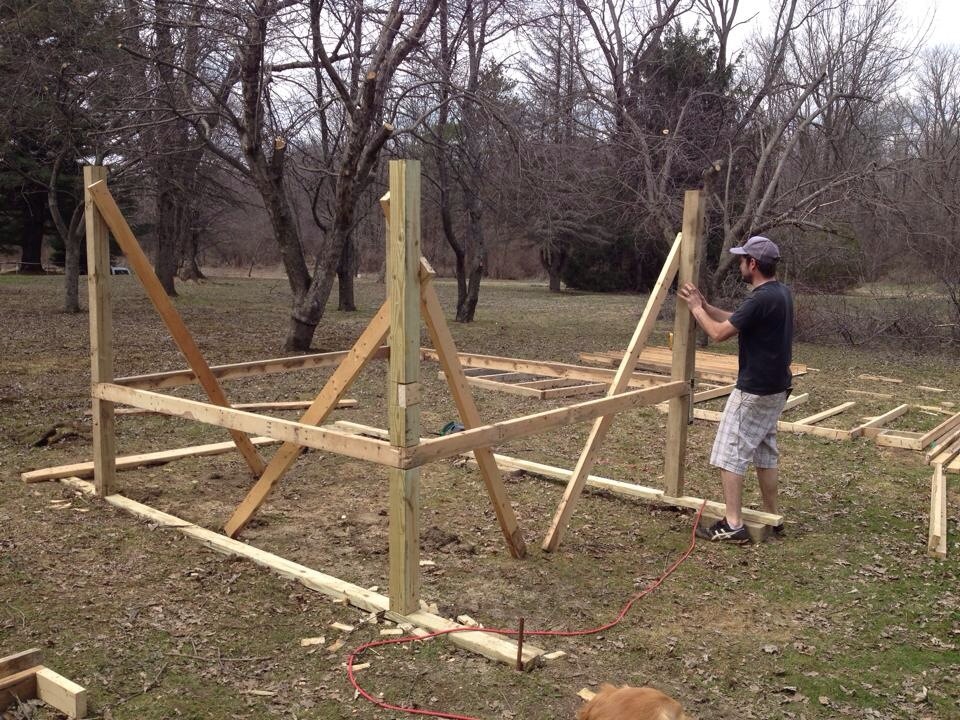 Hubby building the frame of our first coop!