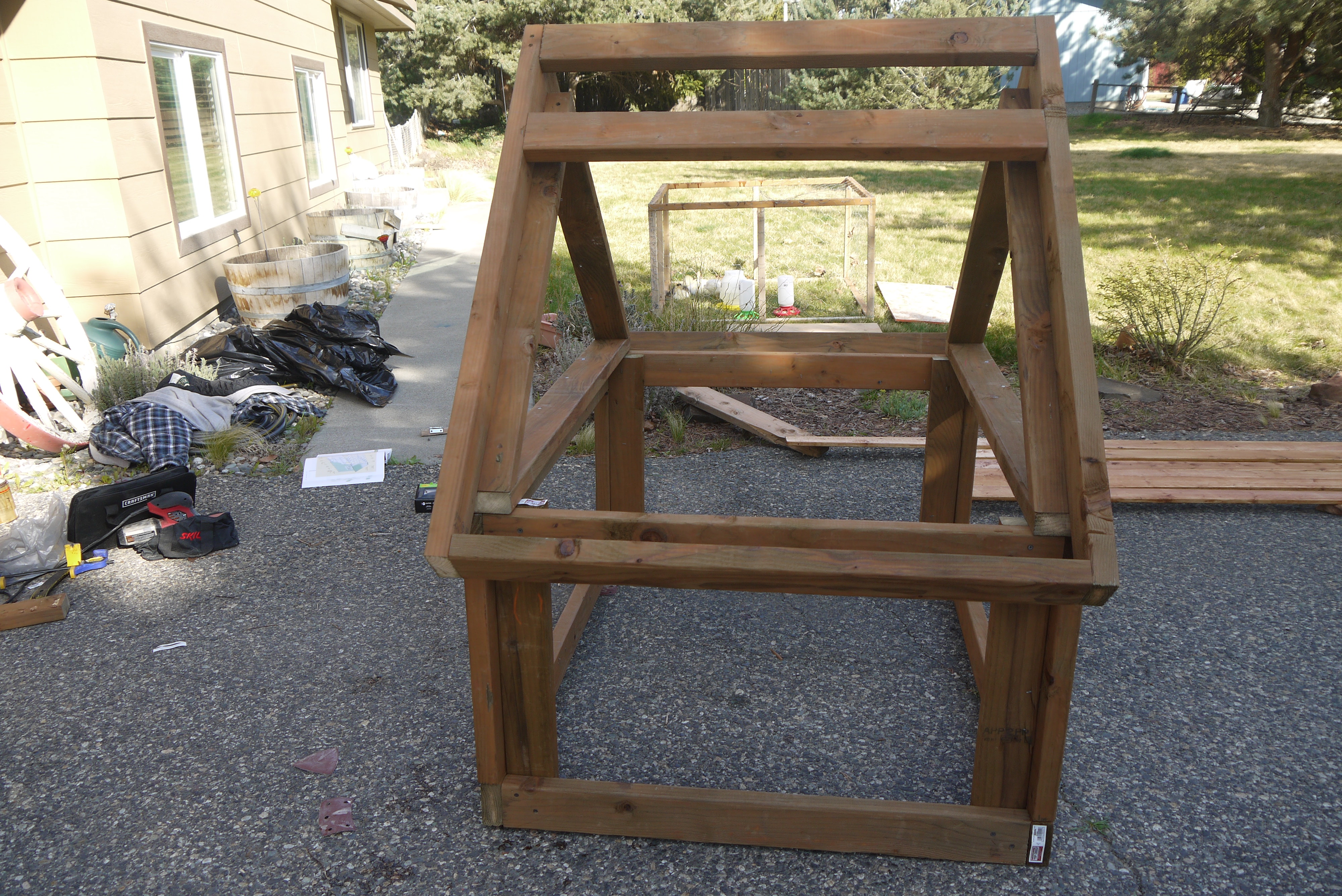 I added the second 2x4 on the side that would have the opening.  This board will allow me to anchor down the hinges.