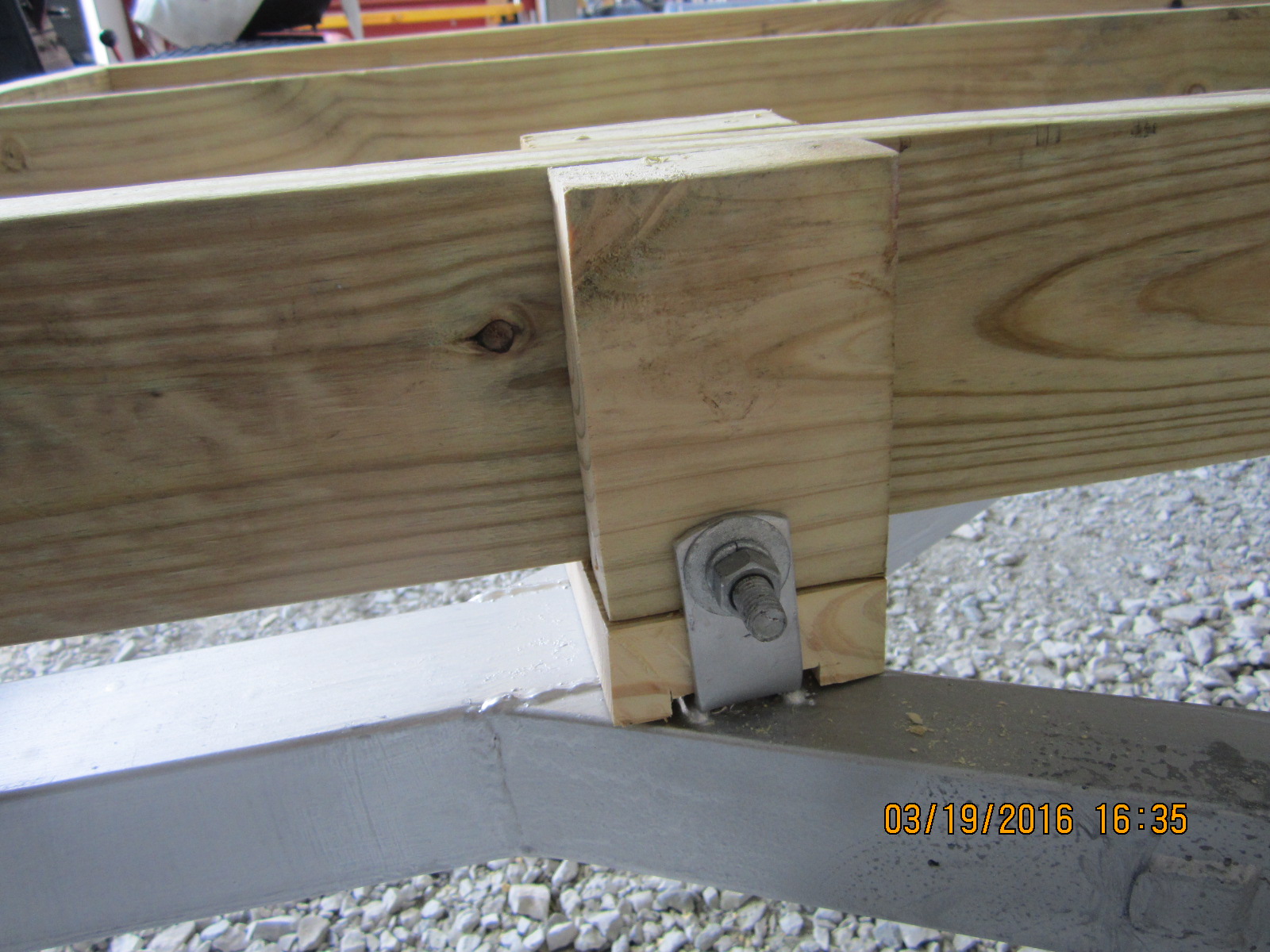 I also built up and used the old roller hardware to bolt the front to the frame.