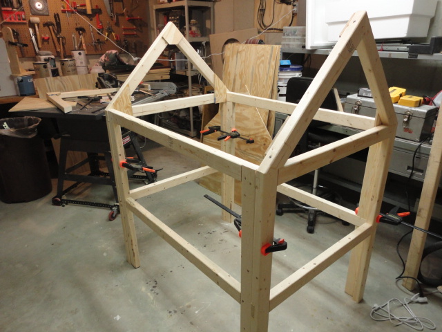 I glued and screwed front and back to the sides and added roof rafters, also glued and screwed.