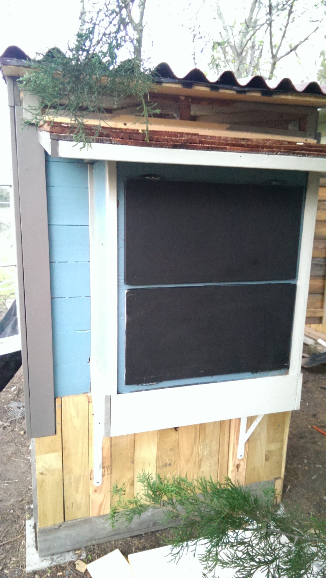I spray painted the doors with chalboard spray because I wanted to be able to keep an Egg Talley for my girls per week, we'll see if this actually happens.
