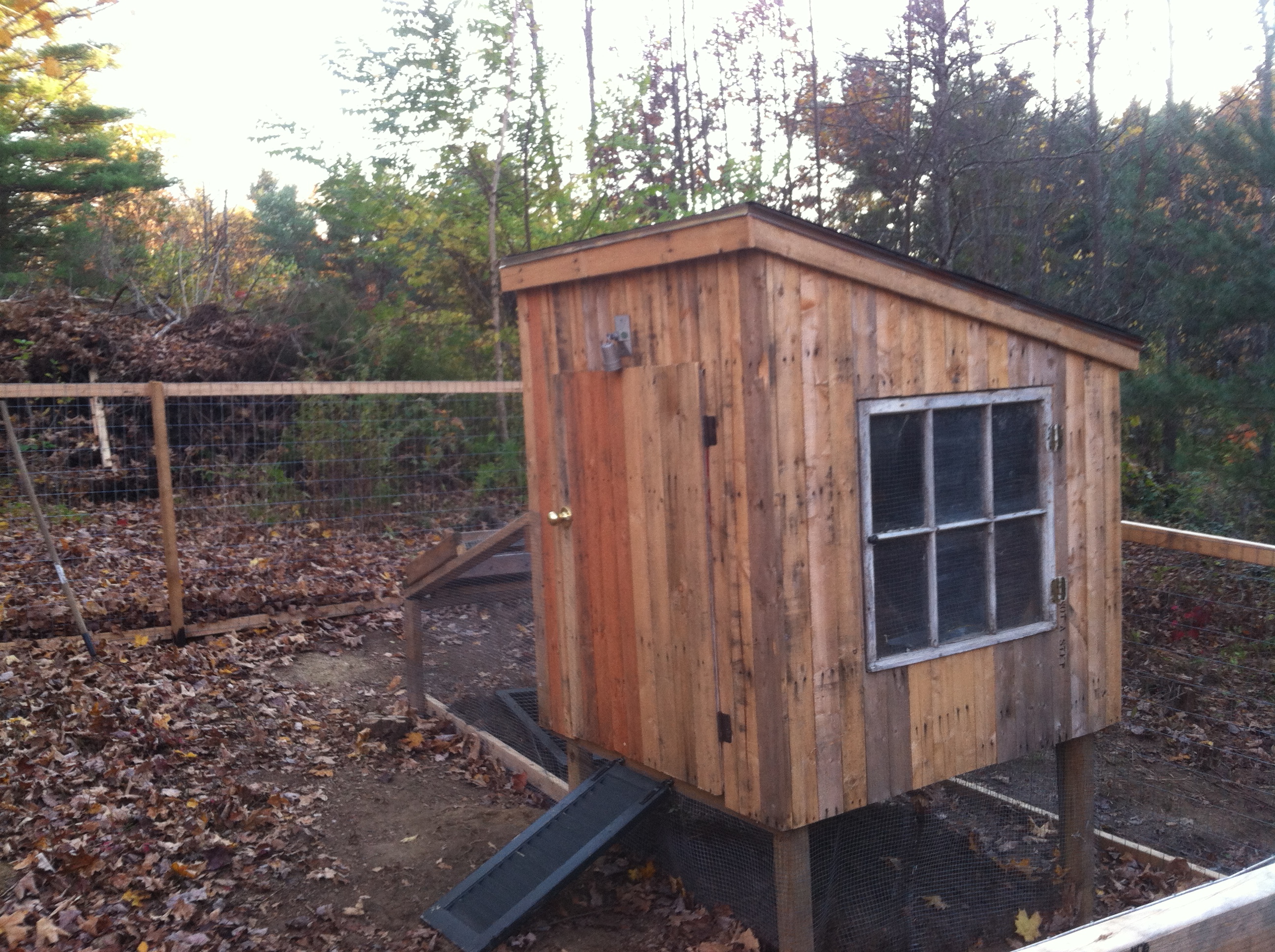 I took an old shutter I had and cut in half to make ramps for the chickens.  All the hinges and the bolt locks and door knob were reused from other projects and demo sites.
