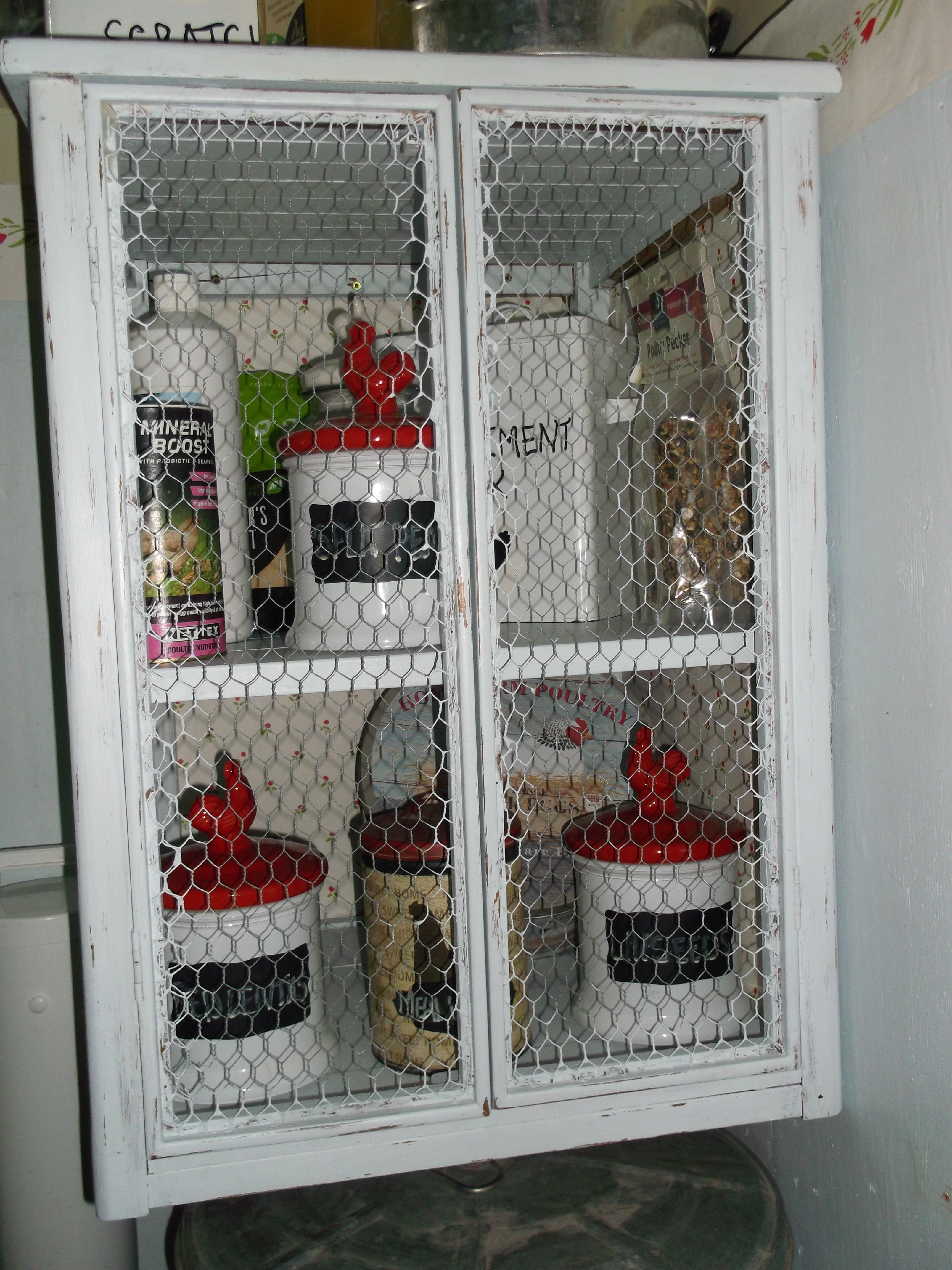 I ''upcycled'' another cupboard for storage in the coop