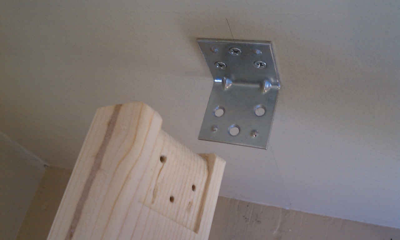 I used 4 L brackets whenever the 2x3 touched a wall.
