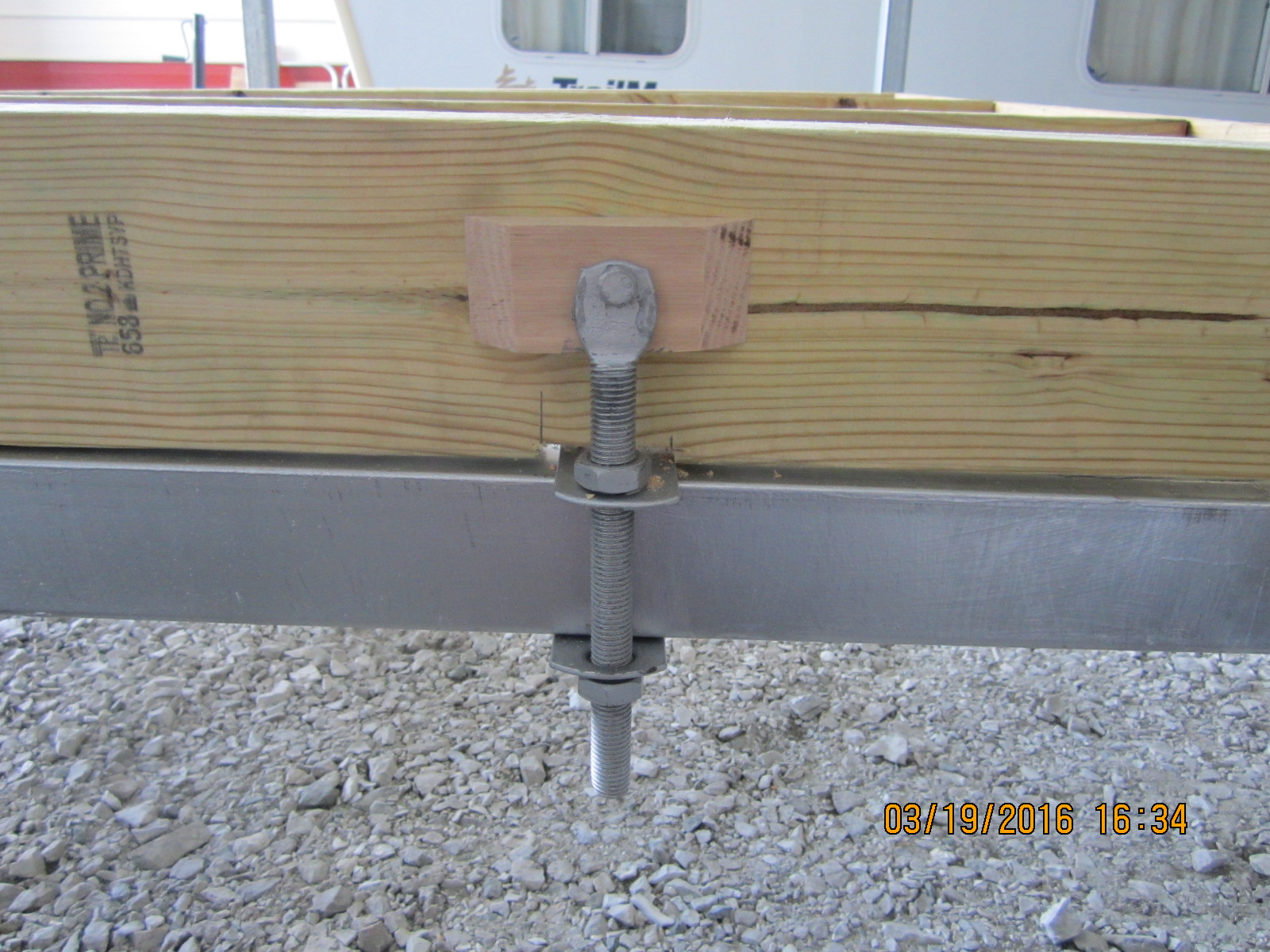 I used the old hardware that came with the trailer to bolt it to the frame.