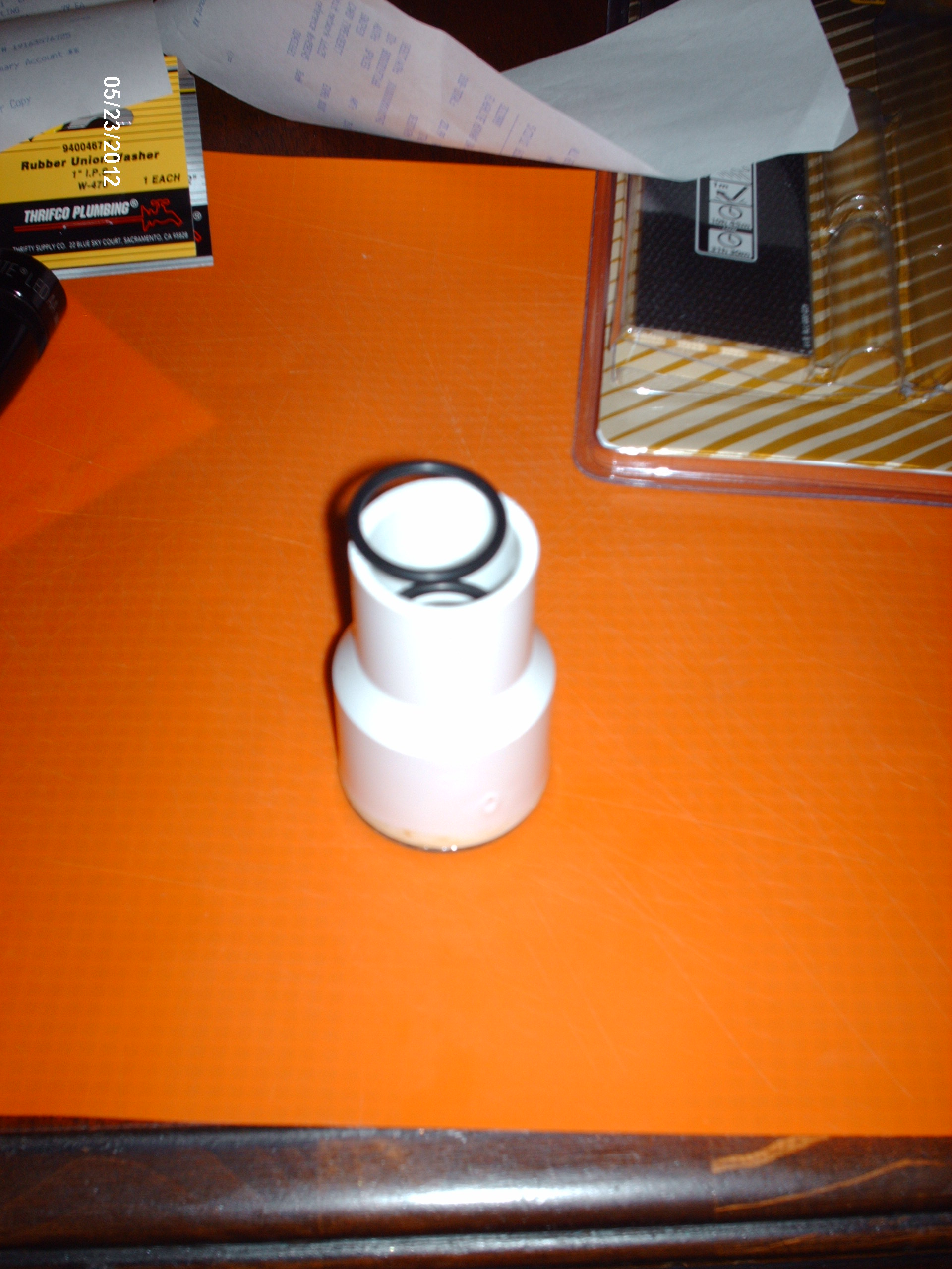 Insert 2 rubber O rings (one at a time) inside the SMALL end of the coupling. Roll them down inside until they seat nicely up against a lip that is in there. This helps to seal the light around the top of the mag light and the coupling. You can see there is one down inside already.
Pkg of 2@ 15/16" (ID) - 1 1/8" (OD) - 3/32" (Wall) 
Molded Rubber O Rings = $.79