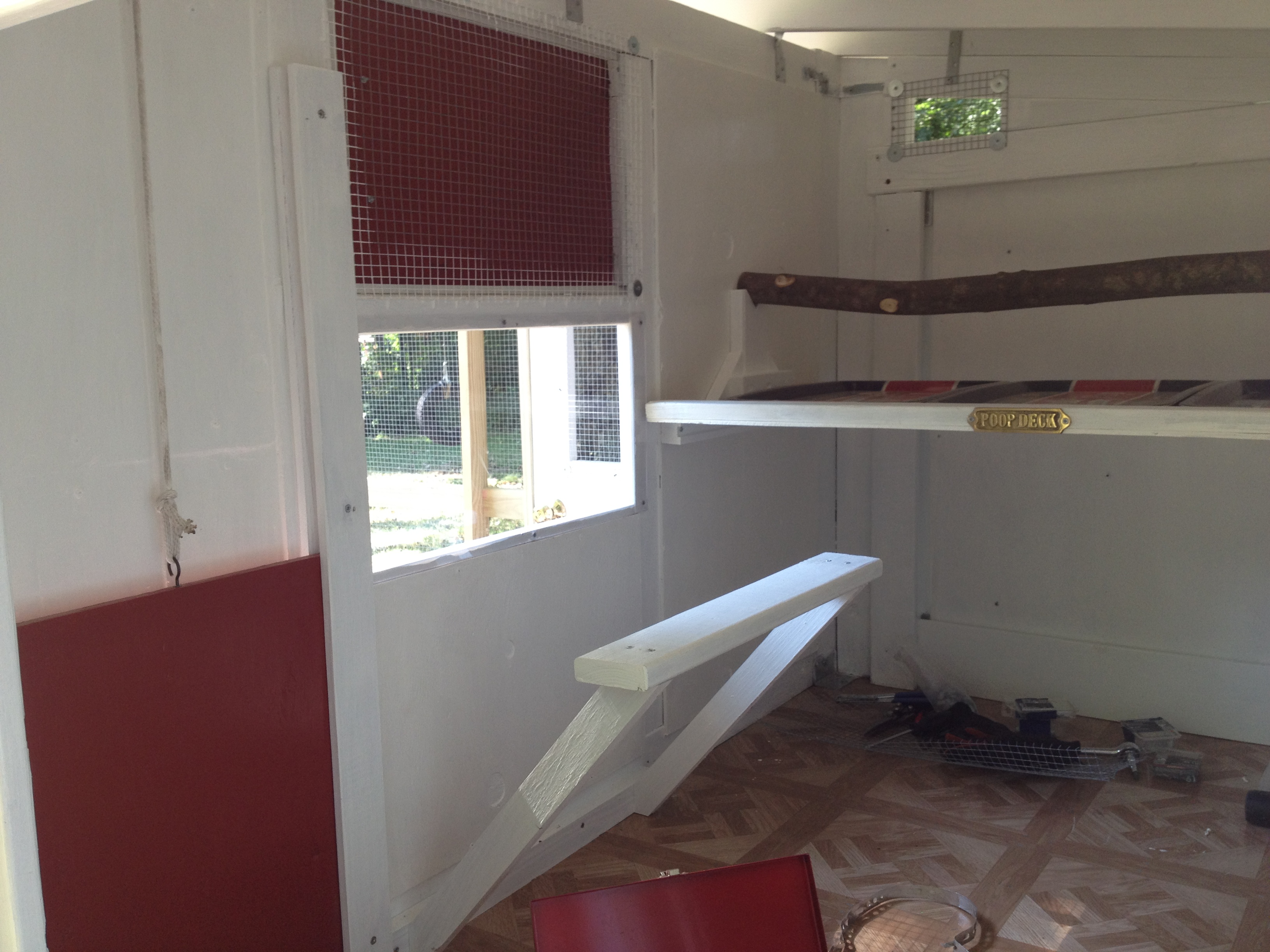 Inside coop, pop door, windows, perch/roosting bars