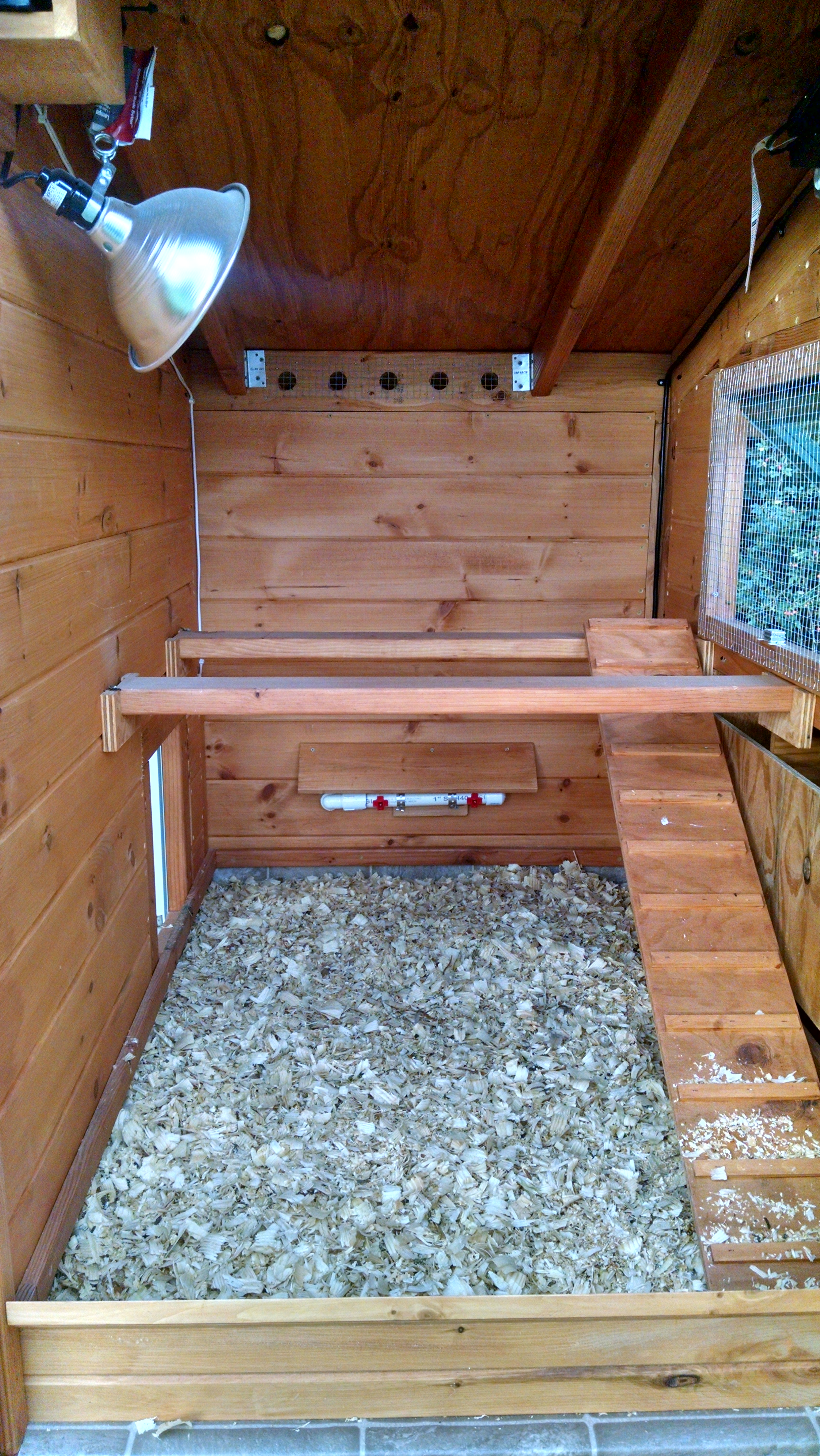 inside of coop. waterer in the back for the winter