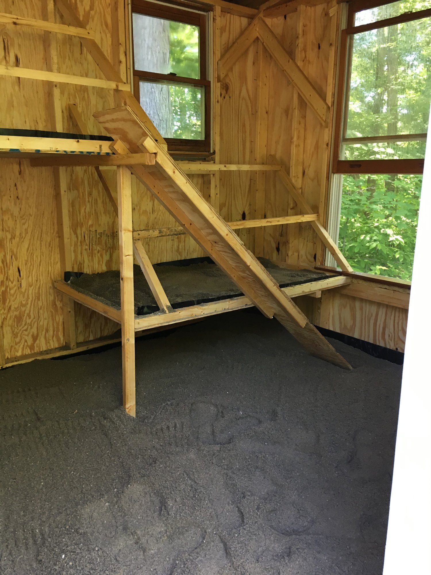 Inside of the 8’x10’ coop with two levels of roosts
