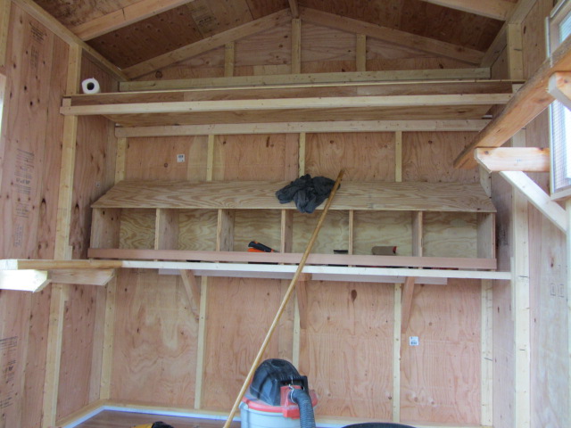 inside of the coop I built a loft perches and hung up my nesting boxes