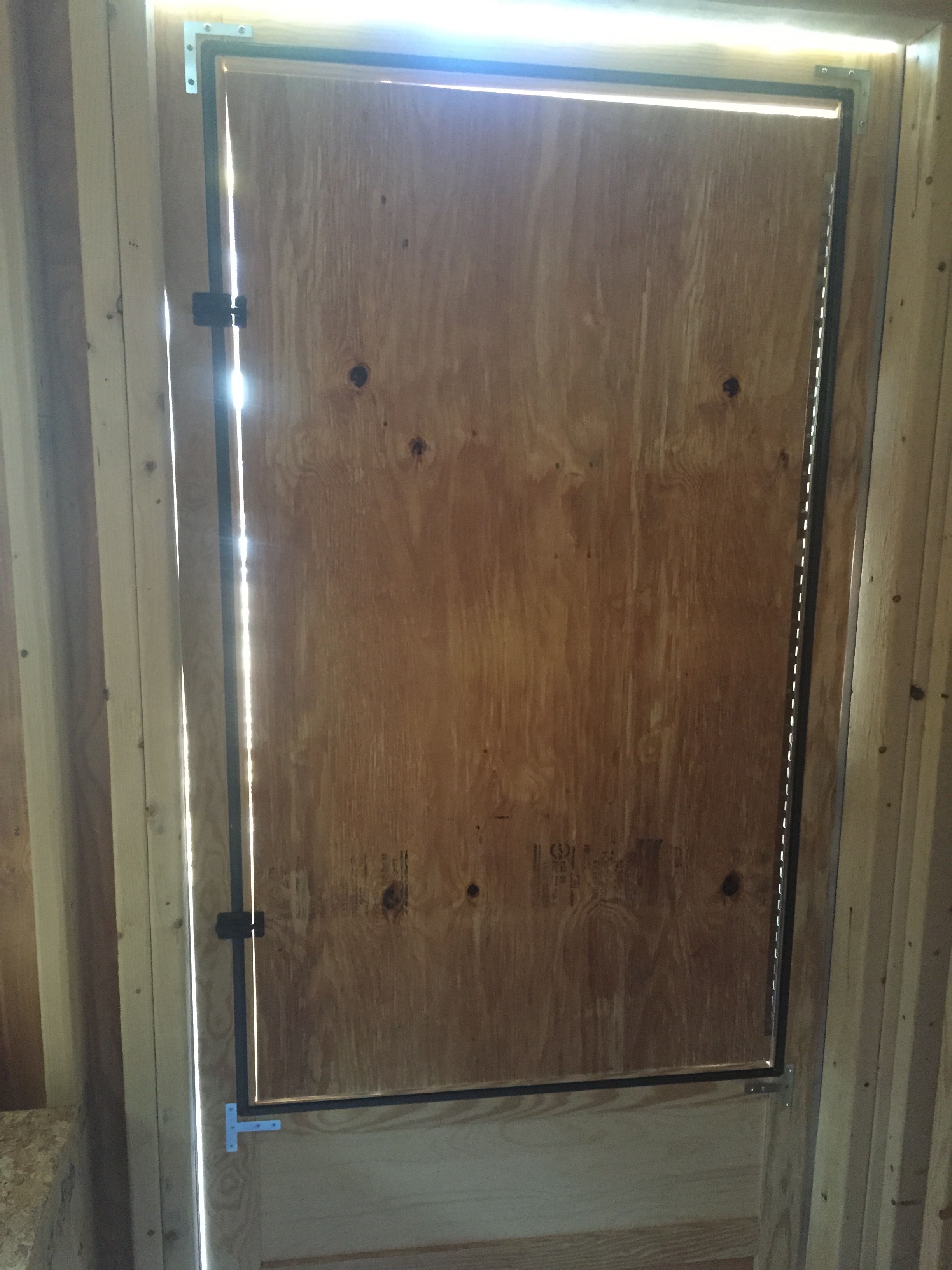 Inside of the door, you can see the piano hinge we installed so we can open it up!