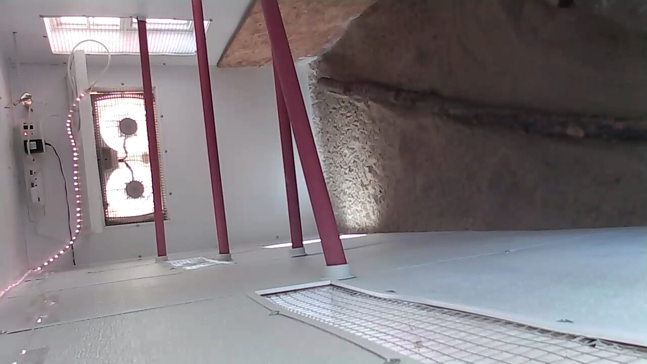 inside the hen house. I used dowels for their roosts. I also put a small tree trunk on the sandy bottom in case the girls could not jump up... this was new to them and they slept on the floor for about a week. I put a fan that allows different venting options for the hot summer months