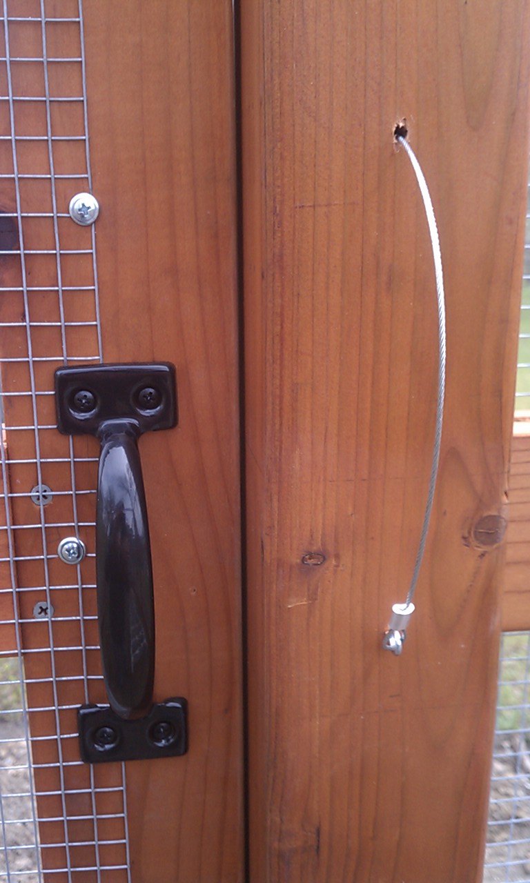 Inside view of the door handle and cable.