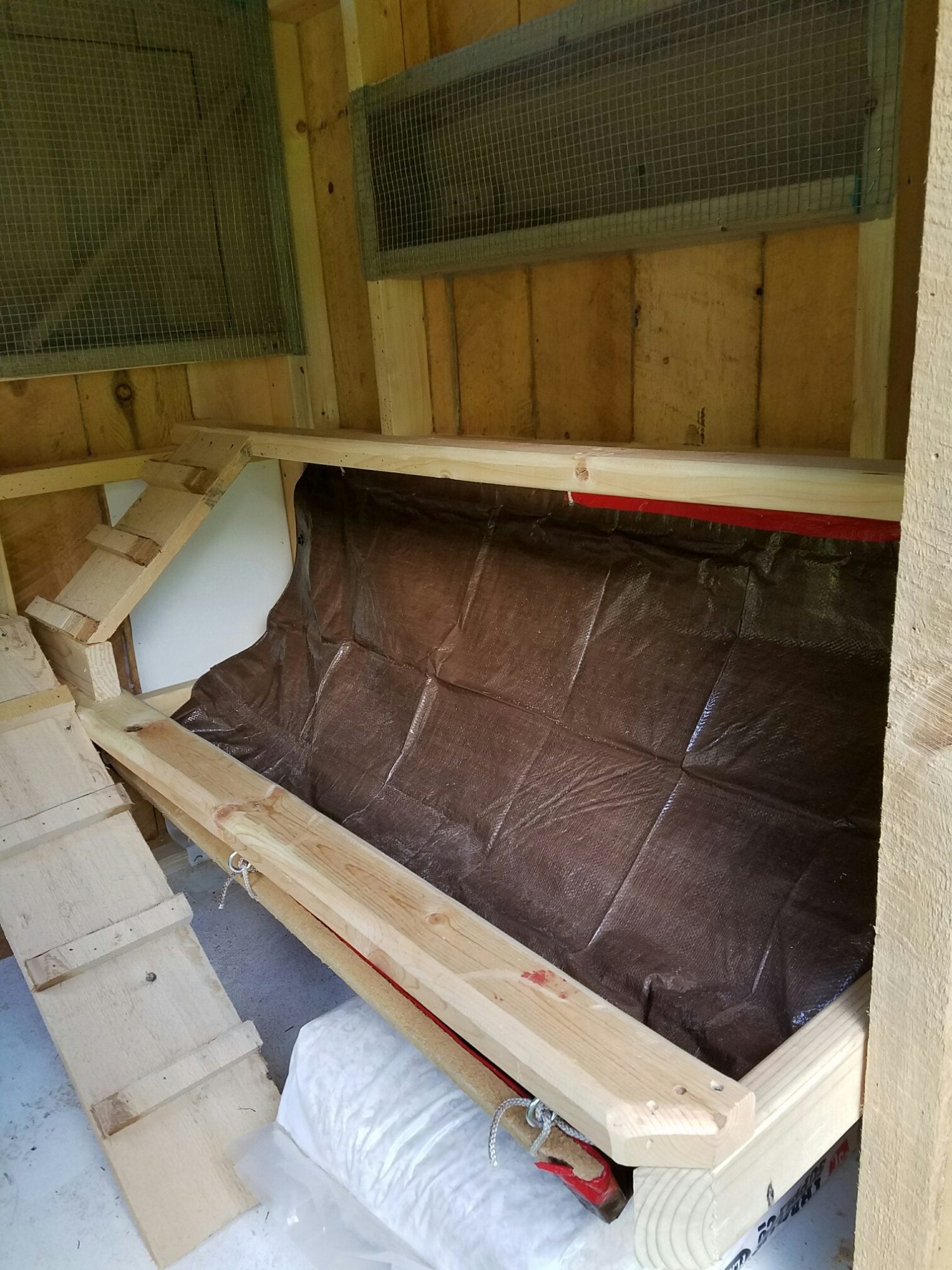 Install a poop hammock under the roost