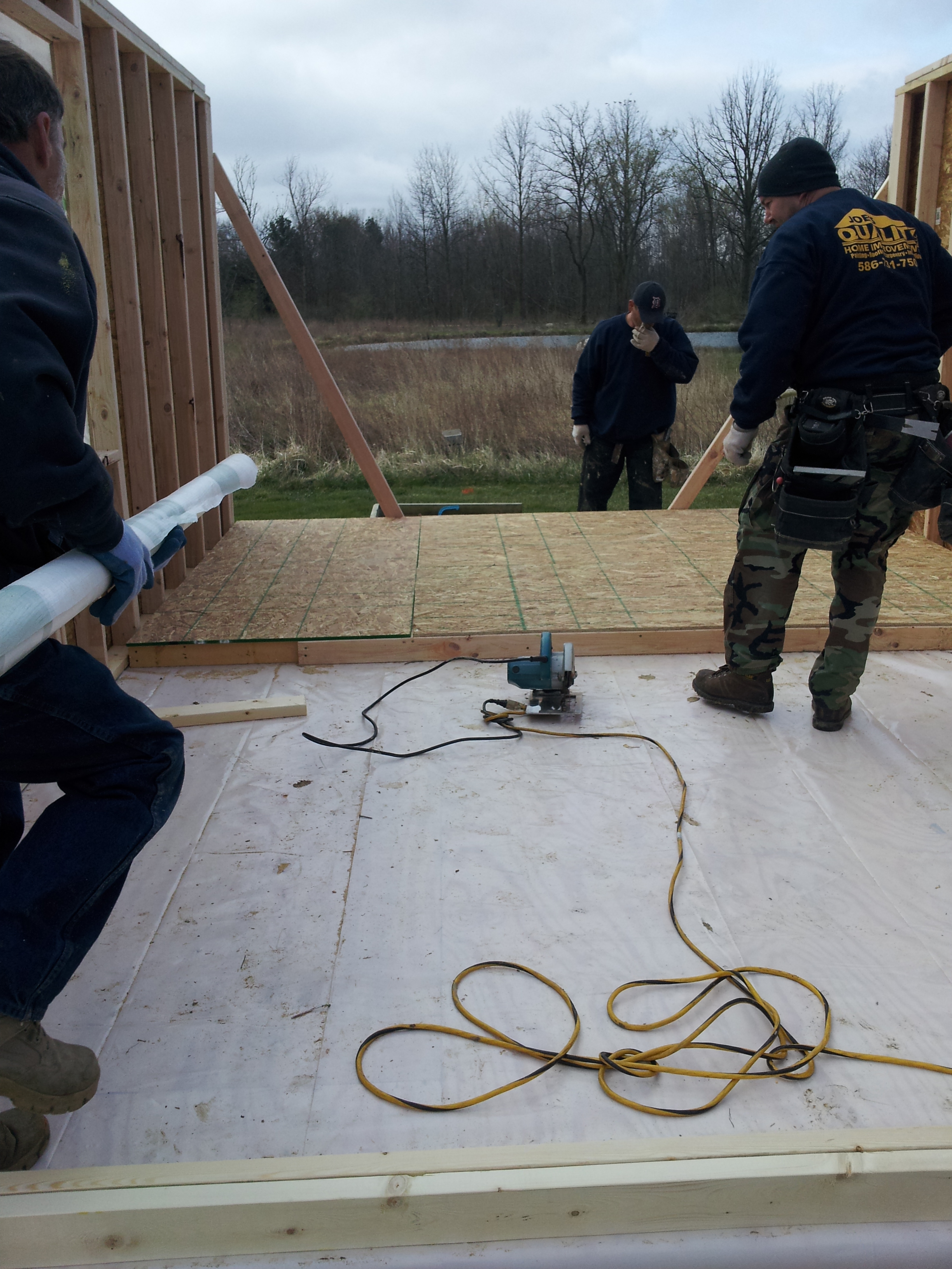 it makes it a lot easyier to also sheet the exterior walls while they are on the ground.  We also put the house wrap on at this point.