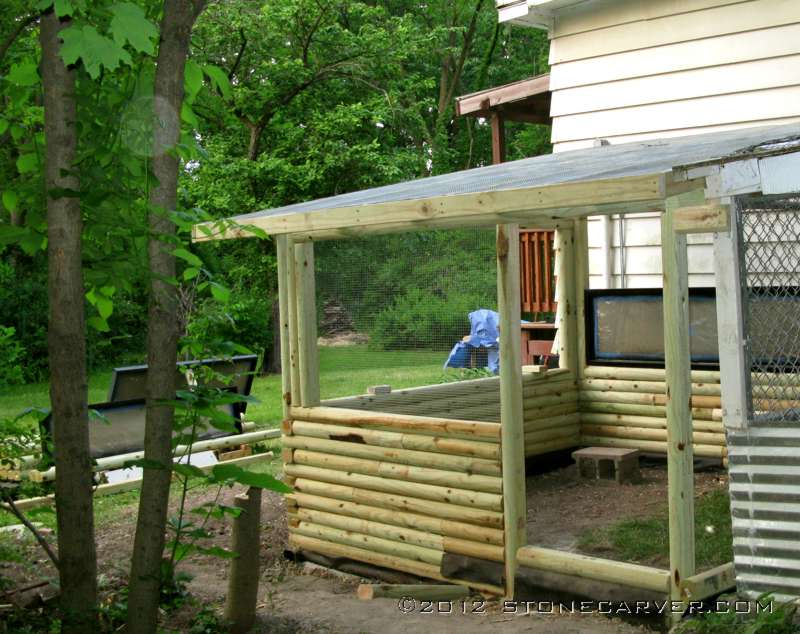 It's all framed out, the windows are going in. The plexi windows are on two sides, and a large opening covered with hardware cloth on the side next to the door.