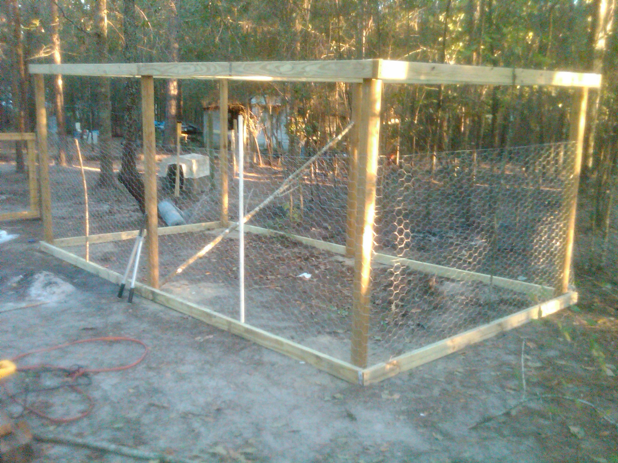 Just getting started good.  the landscape timbers are in the ground about 18 inches giving me 6.5 feet of height inside the run.  Note though pretty the perch is at an impossible angle for the birds but that was corrected soon as they had issue with the steep angle.