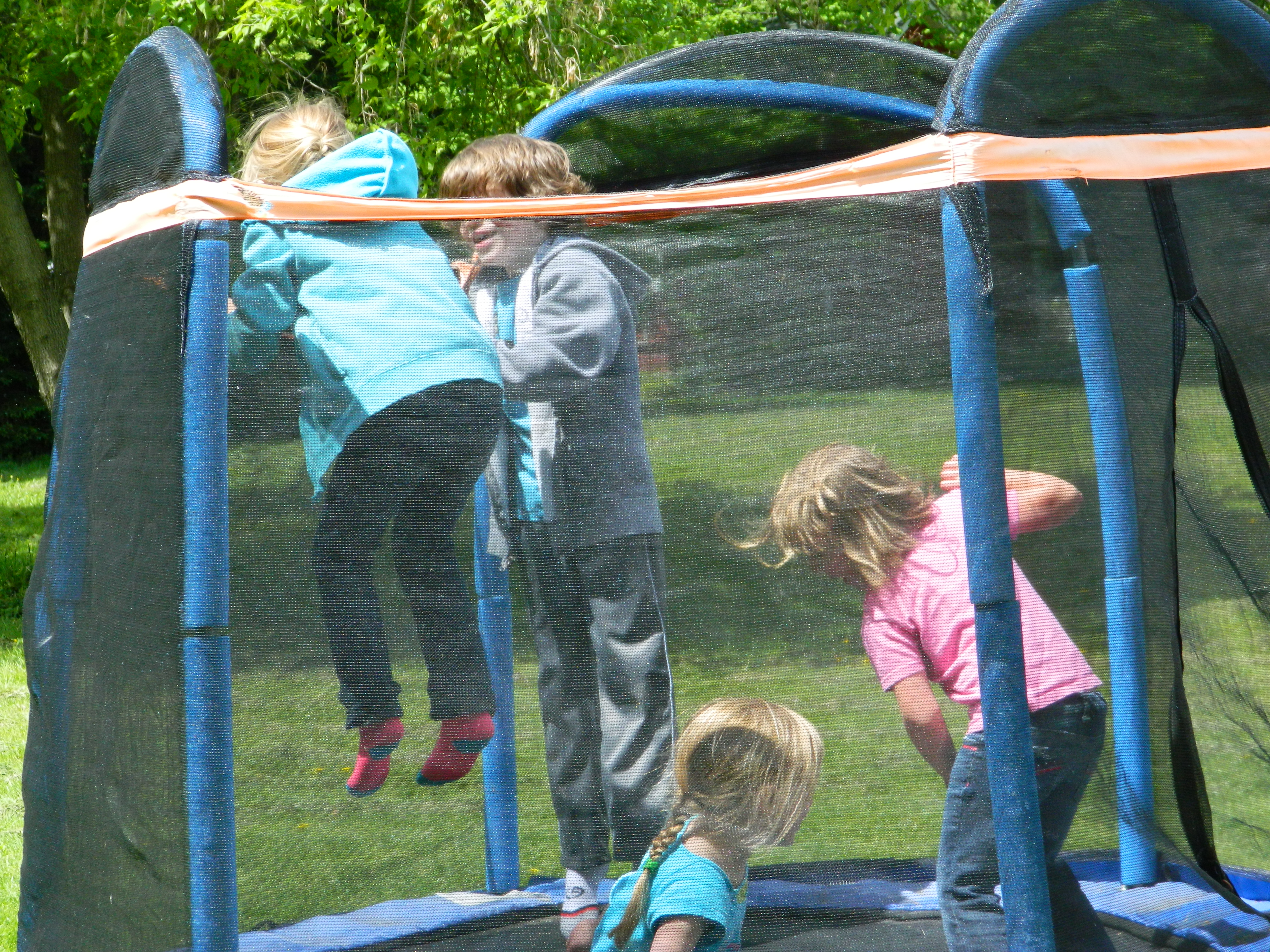 Kids having a ball on the trampoline.