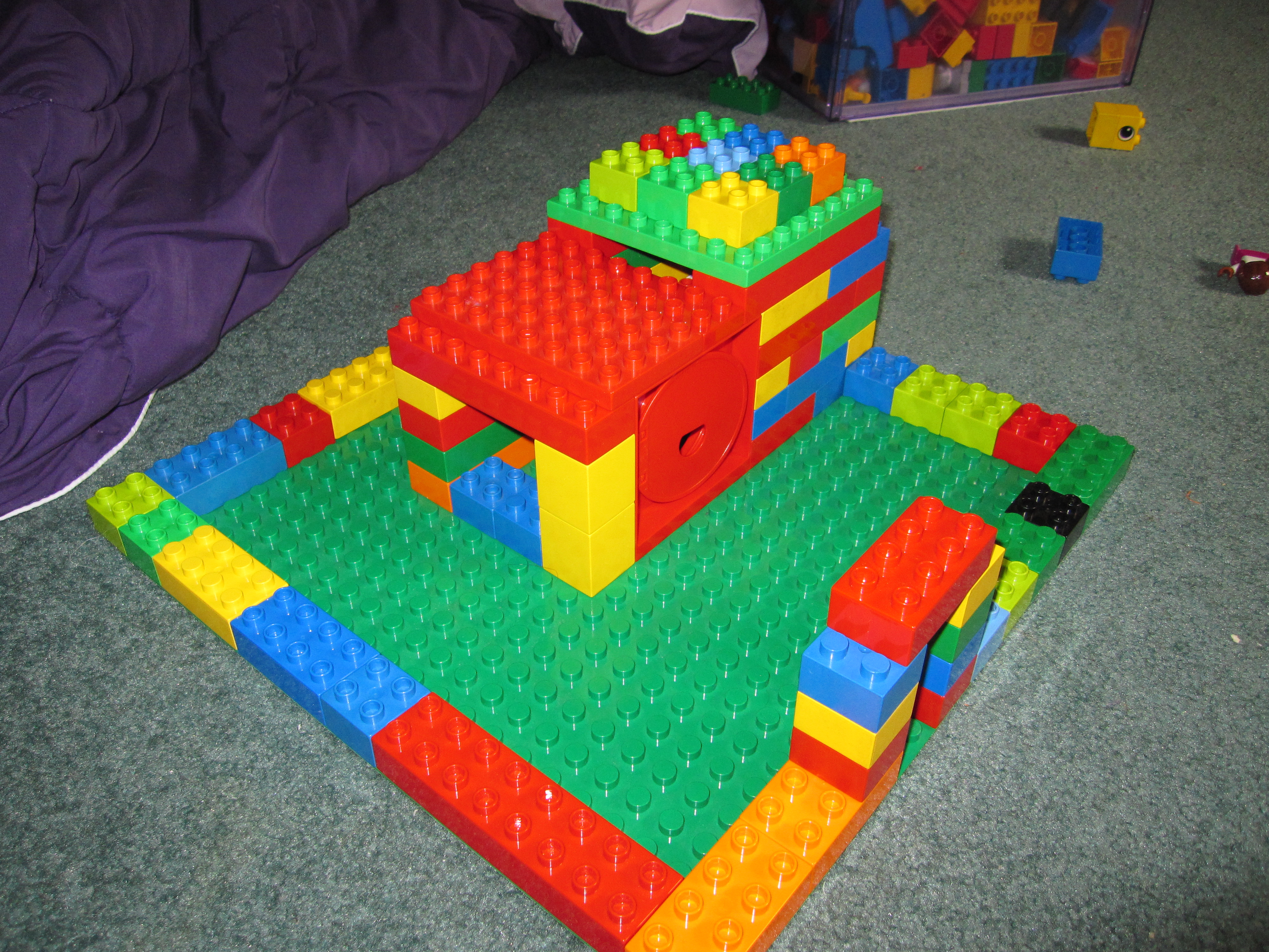Lego fresh air coop - I built the coop, my 3 year old built the yard and decorated the roof.