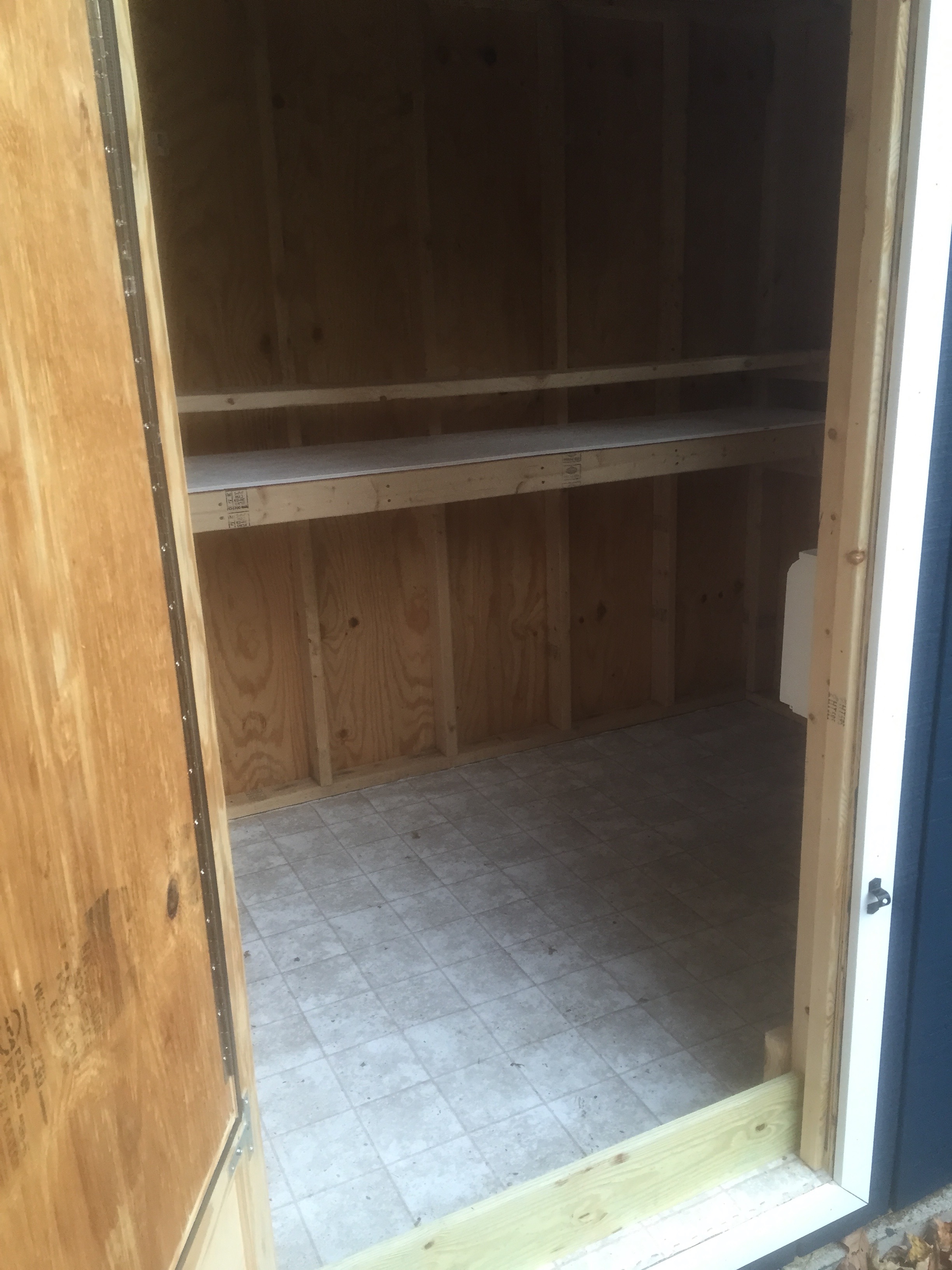 Linoleum remnant put down on the floor to protect against moisture and to give us a wipeable surface.