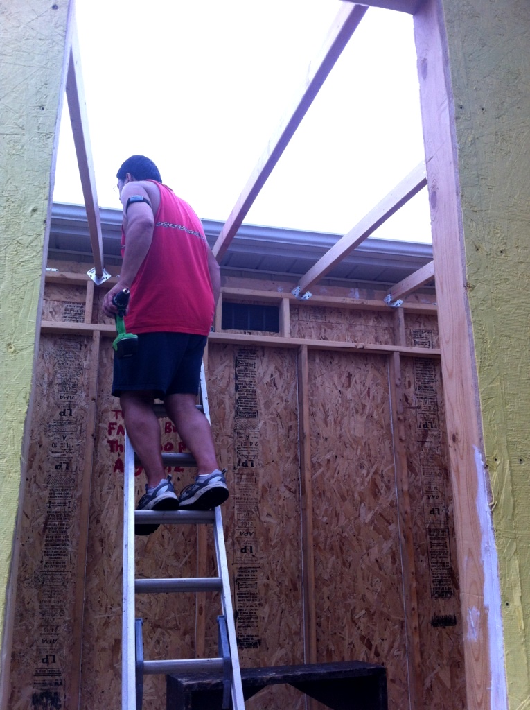 Lito building the roof rafters