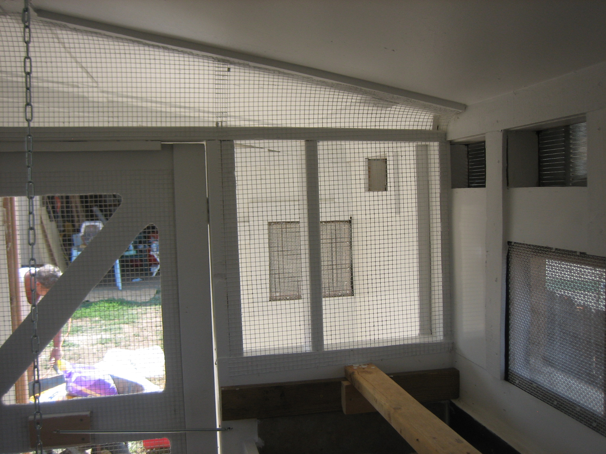 Looking from the coop into the storage area.  We tried to make it as light and with plenty of ventalation as possible.  The interior wall is half inclosed and half hardware just for this purpose.