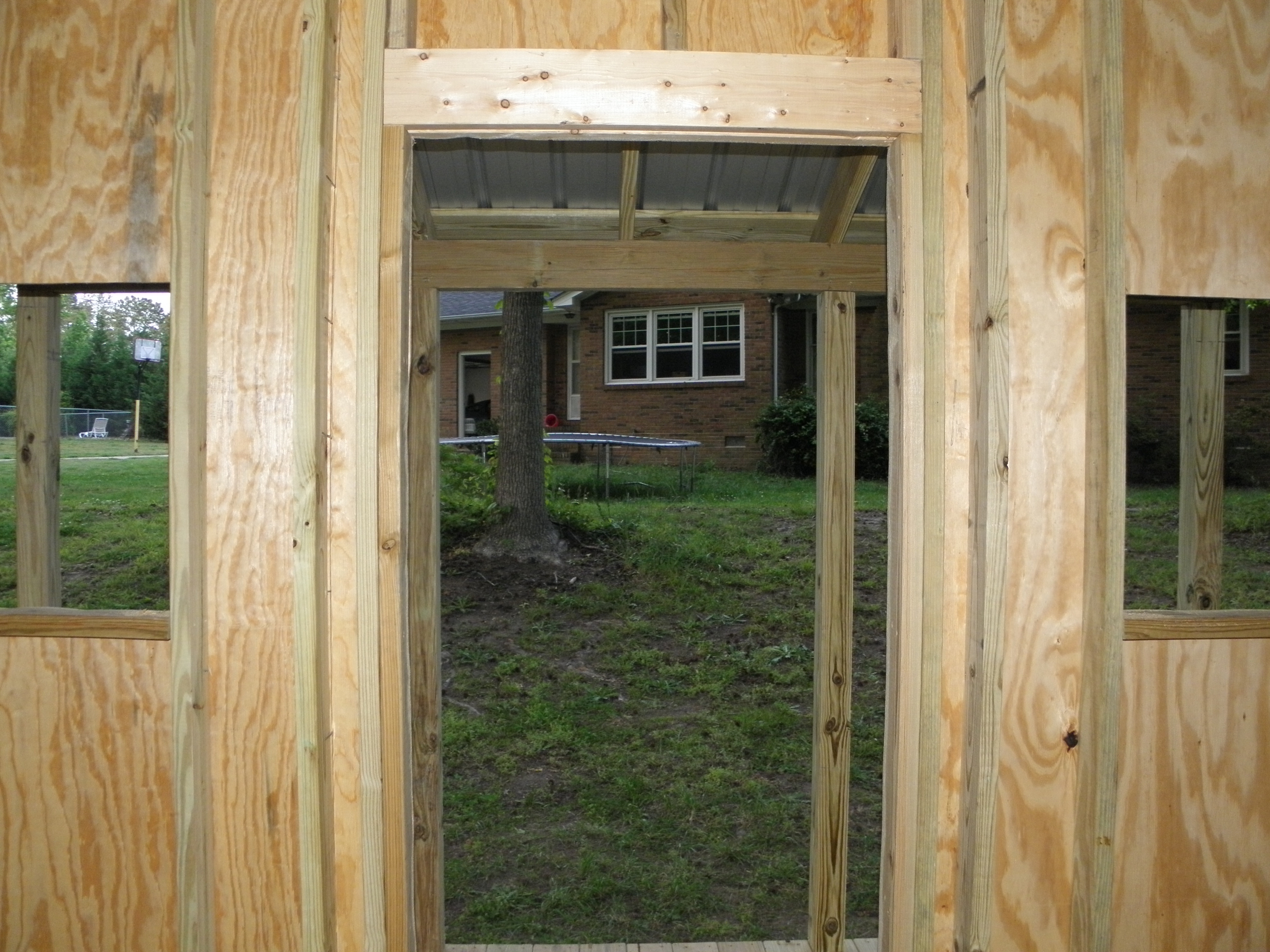 Looking out the front door of the coop up to the house.
