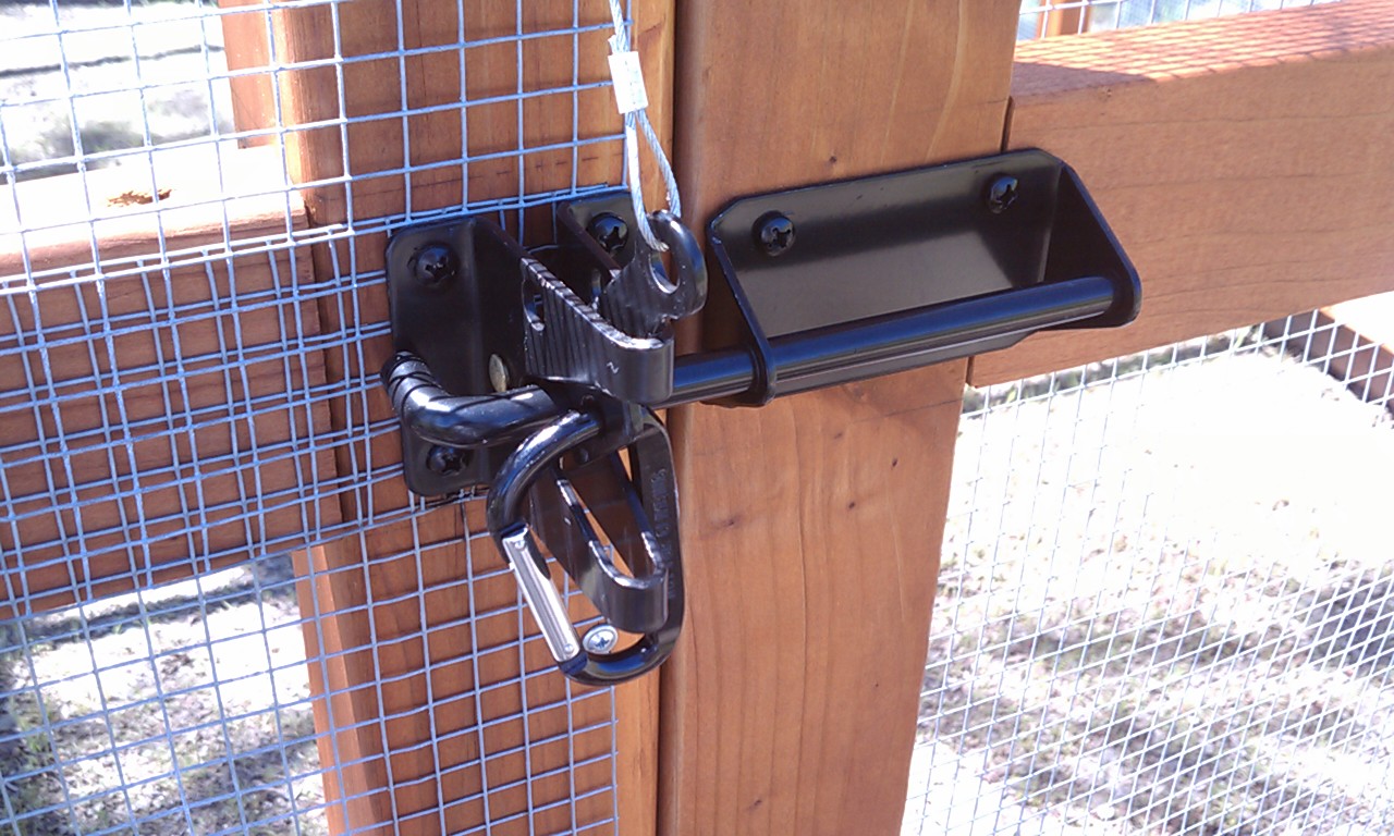 Main door latch and handle mechanism with the carabiner all secure.