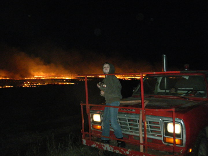 Me on the front of the fire truck when I was younger.  I got to run the hose, and we went through a "wall of fire" a few times. It's awesome!