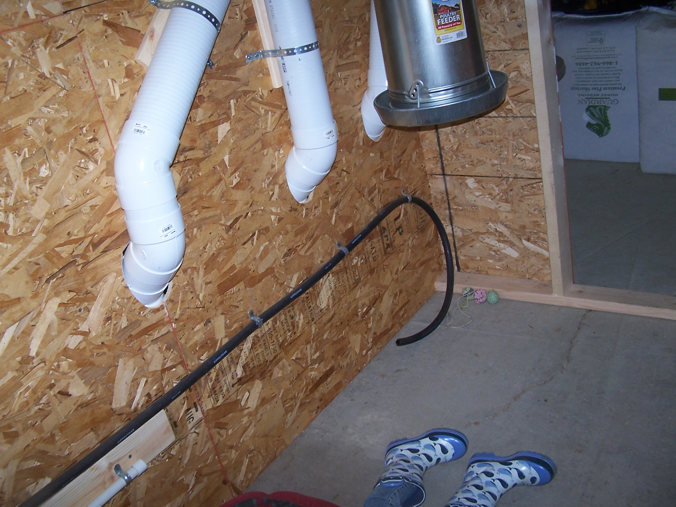 Meat chicken area with feeders on pulleys to be raised and lowered as needed.
