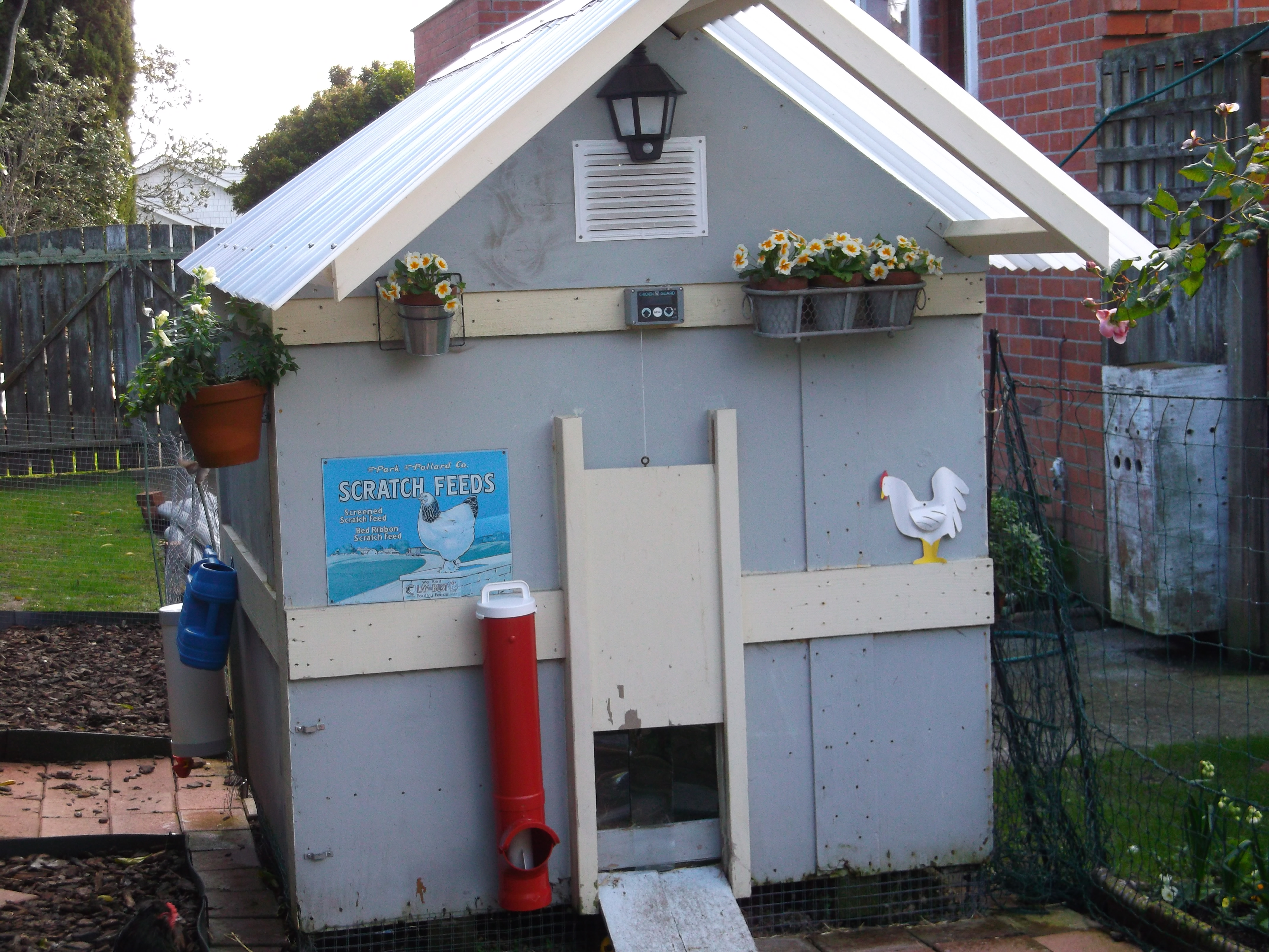 !month till spring but planted some spring colour anyway.Looking at photo i've hung that feeder crooked oh well.