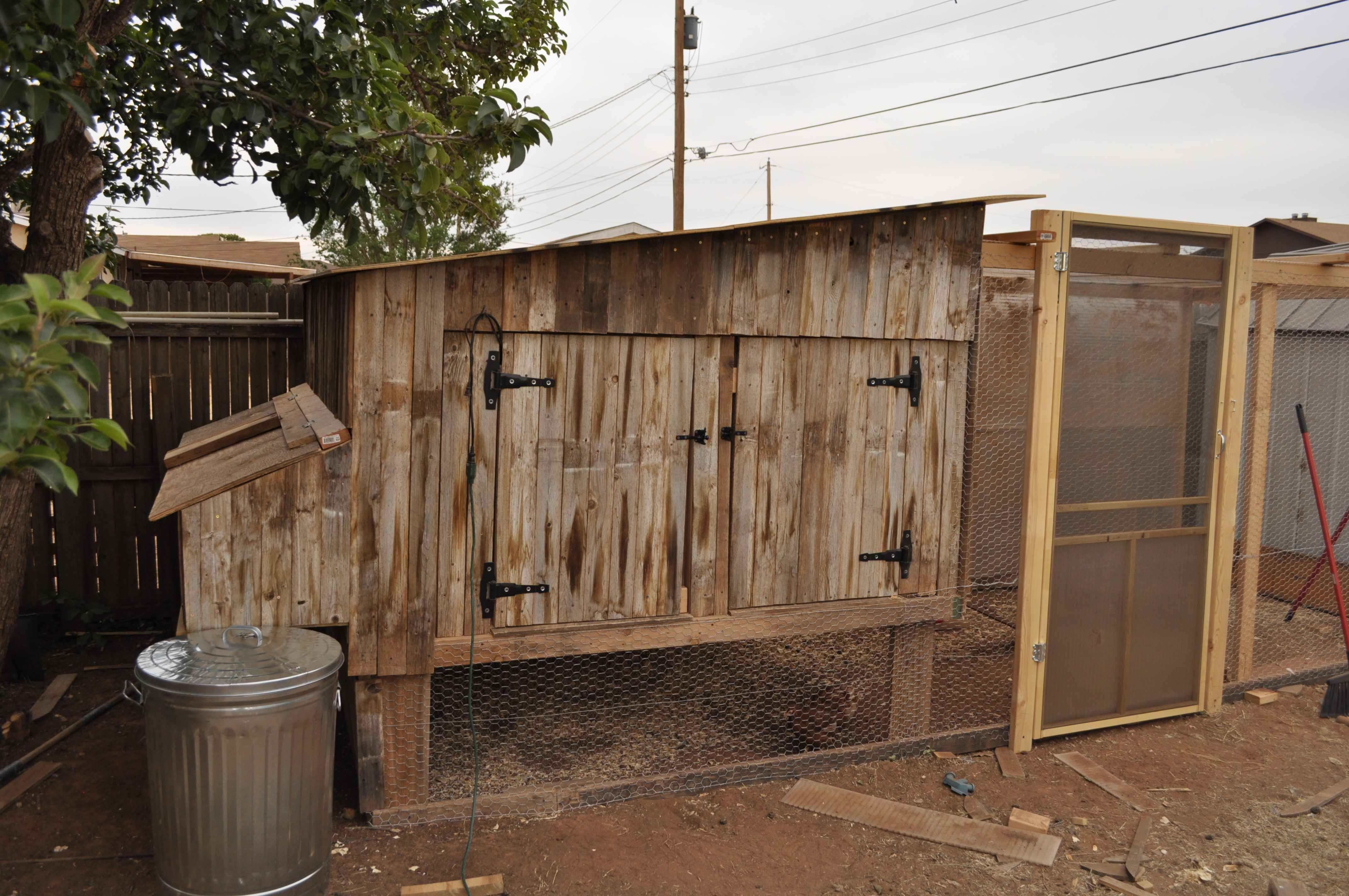 My coop.  Almost entirely made of recycled fence and lumber.  8X8 with 5 nesting boxes on the rear. 7ft tall at the front and 6ft at the back.  It has a slide out  bottom so dropping snd such can be dropped below and raked out.  They have the run of the underneath and the run itself.  Long and tedious process because I had to find the straight pieces of lumber.  It would have been so much quicker if I had used new wood.