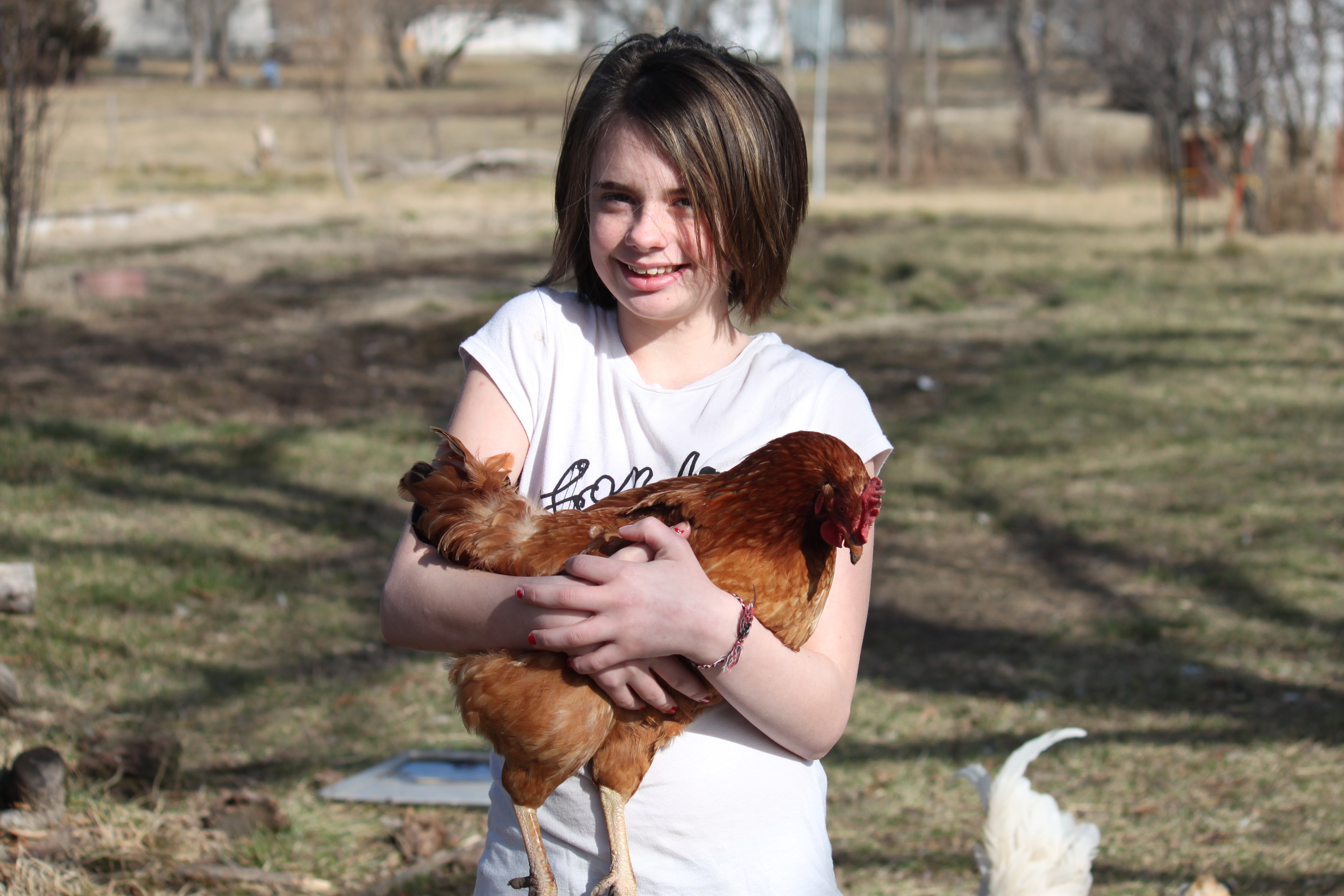 My cousin conquers her fear of chickens.