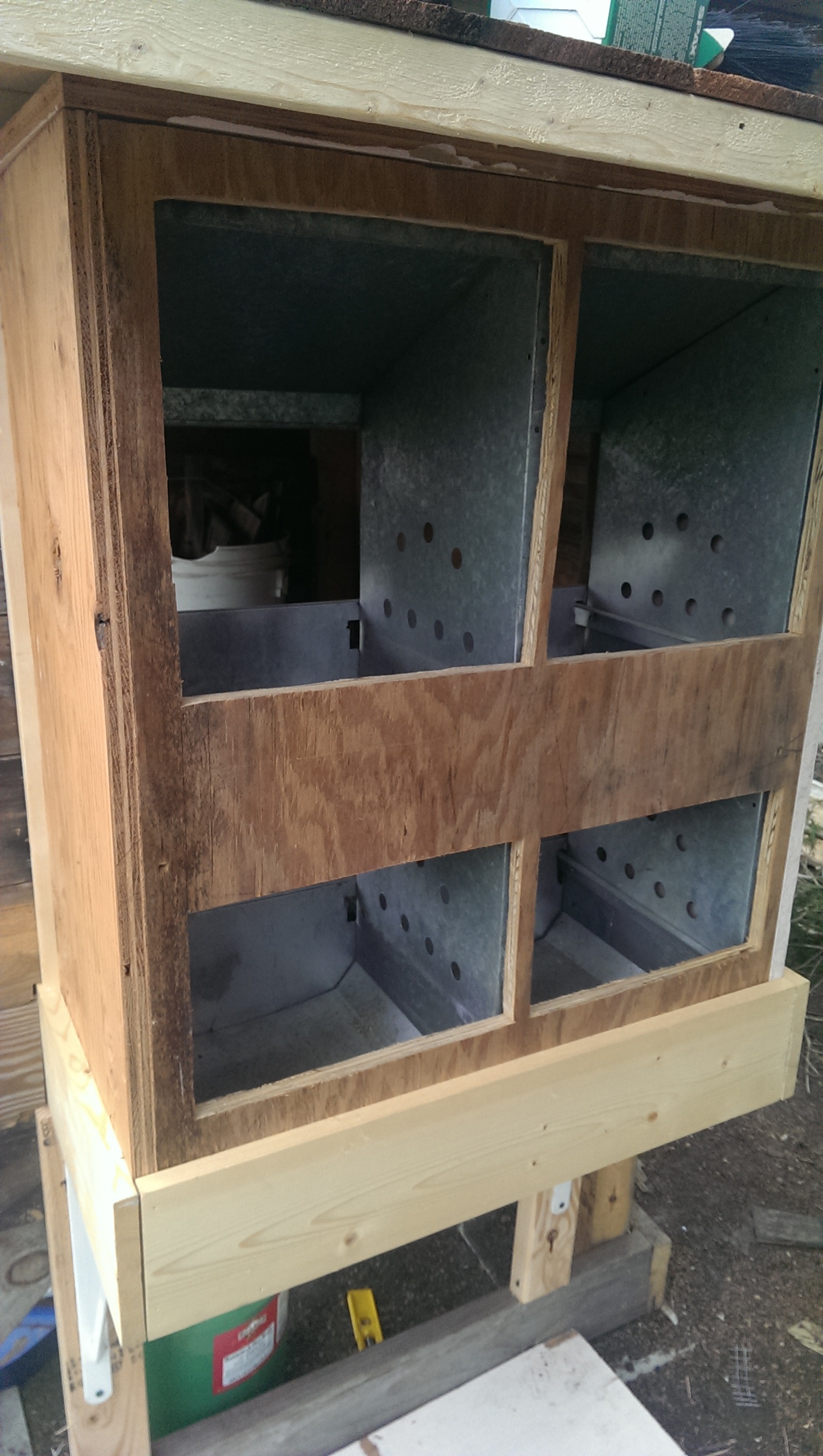 My Dad gave me these galvanized nesting boxes that we mounted onto the back of the coop.