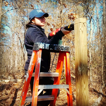 My daughter helping me build a new coop and run.  We lost 3 chickens over a period of 6 weeks free ranging.  We're building a safe place for them, no more free ranging, too many predators here.