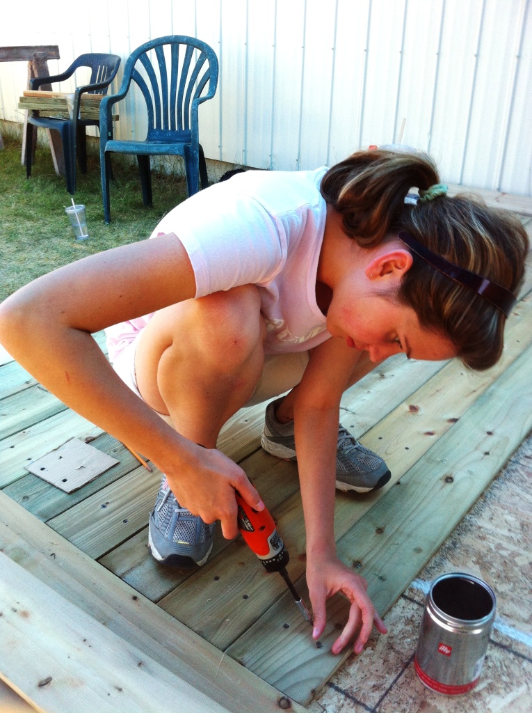 My daughter Jasmine helping to screw the floor boards in.