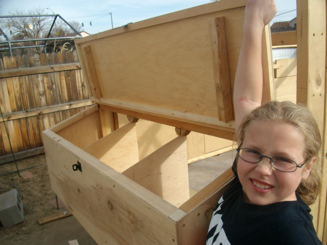 My daughter showing off the nest boxes.