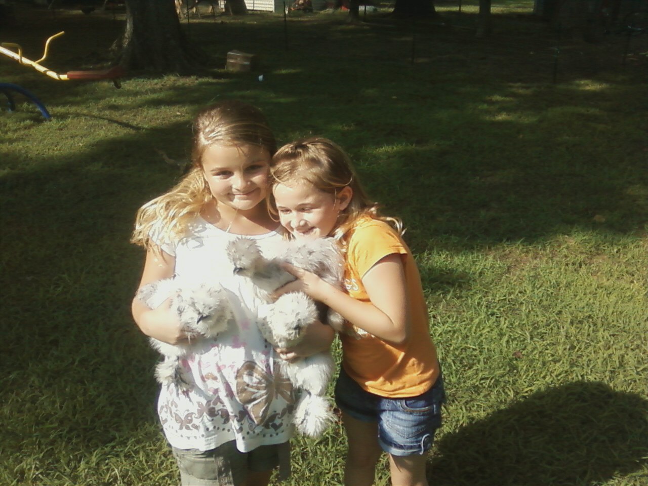 My Daughters Hailey and Elizabeth Holding some splash silkies and whites!