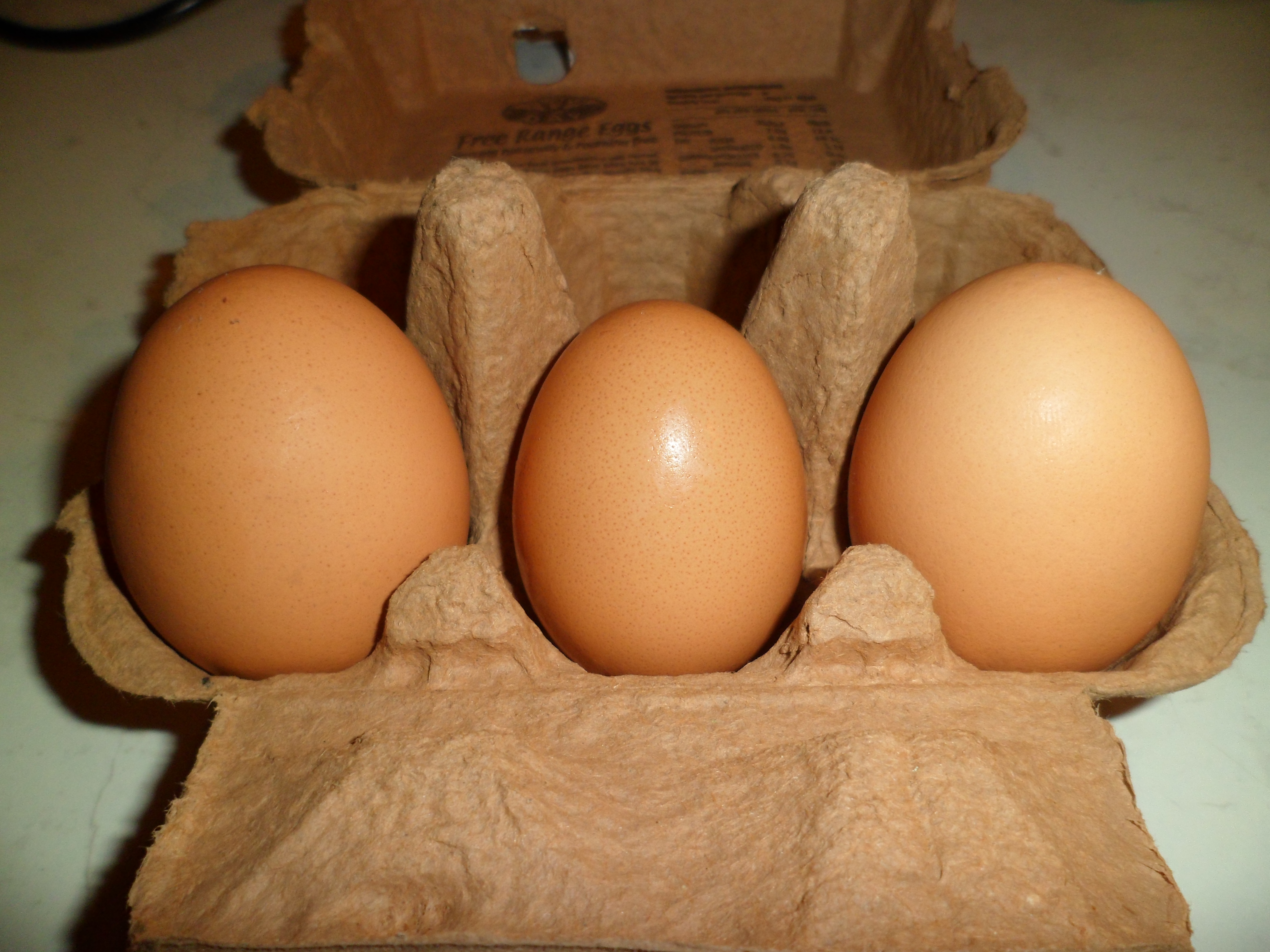 My egg in the middle of two size 7 shop bought ones.