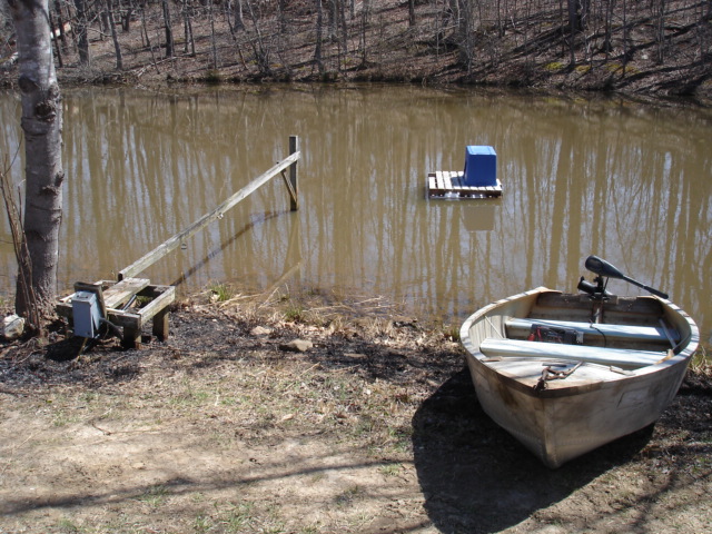 My floating "Duck Island"...
I took a wooden oak pallet and screwed styrofoam to the bottom (bought at lowes from the insulation department, white styrofoam slats), chicken wired the deck to keep stuff and feet from falling thru pallet slats, bought a big tote and cut a door opening and screwed to the pallet, and anchored it in the pond....it naturally always faces the door downwind for the best weather protection