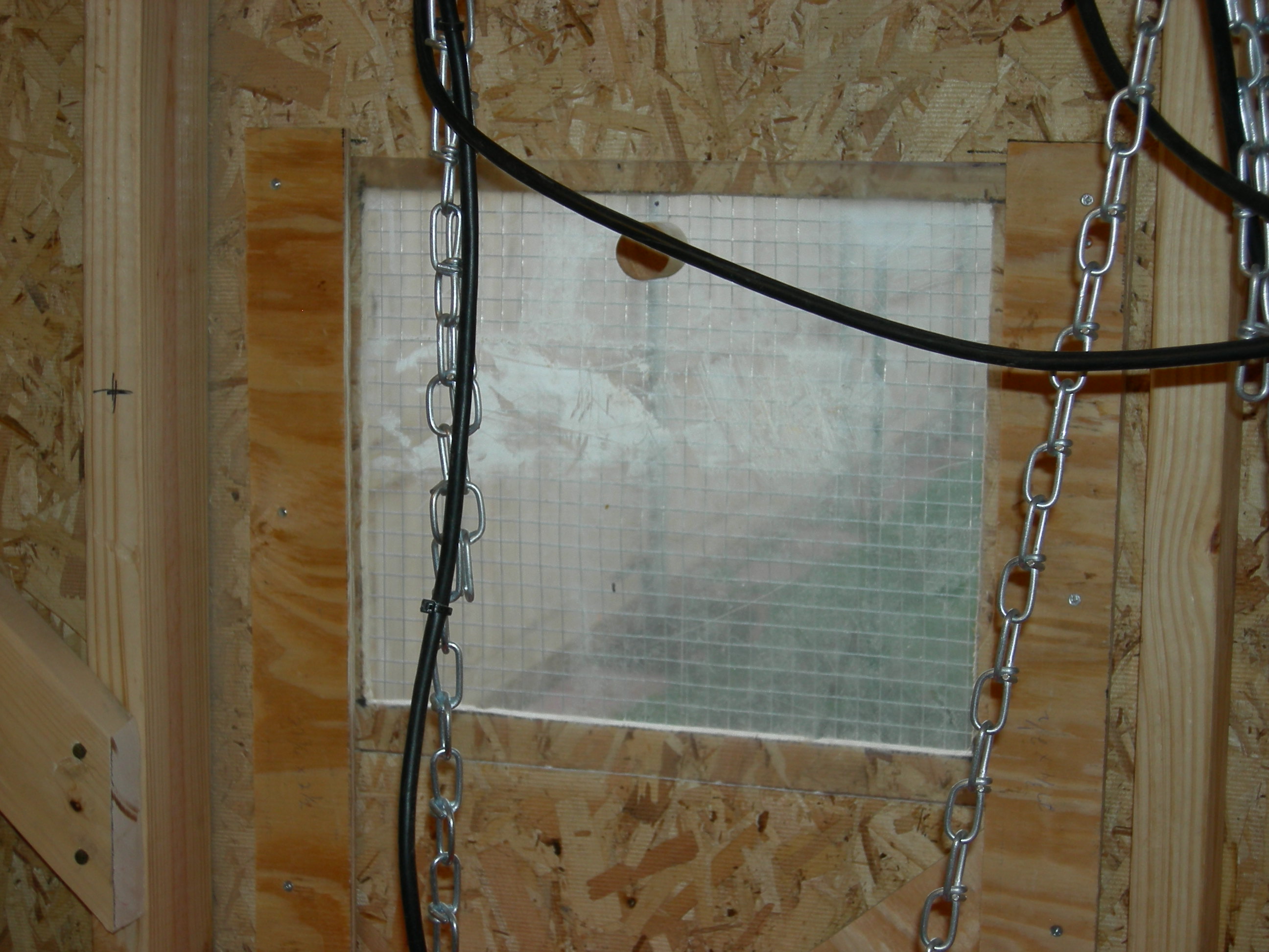 My husband added a wooden knob at the top to make the window easier to raise and lower.