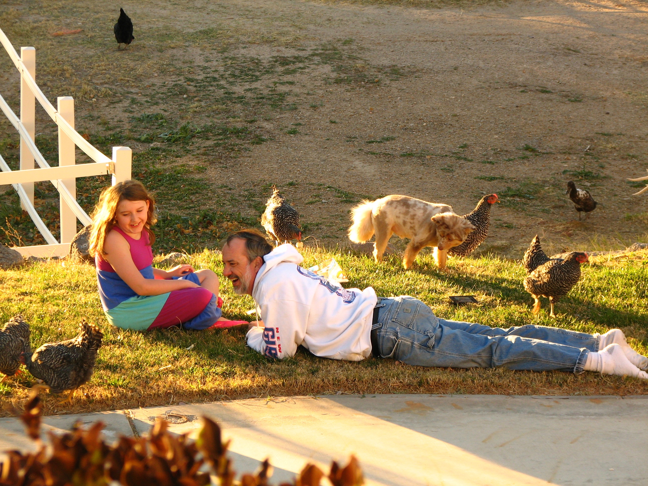 My husband and one of our daughters enjoying our chickens.