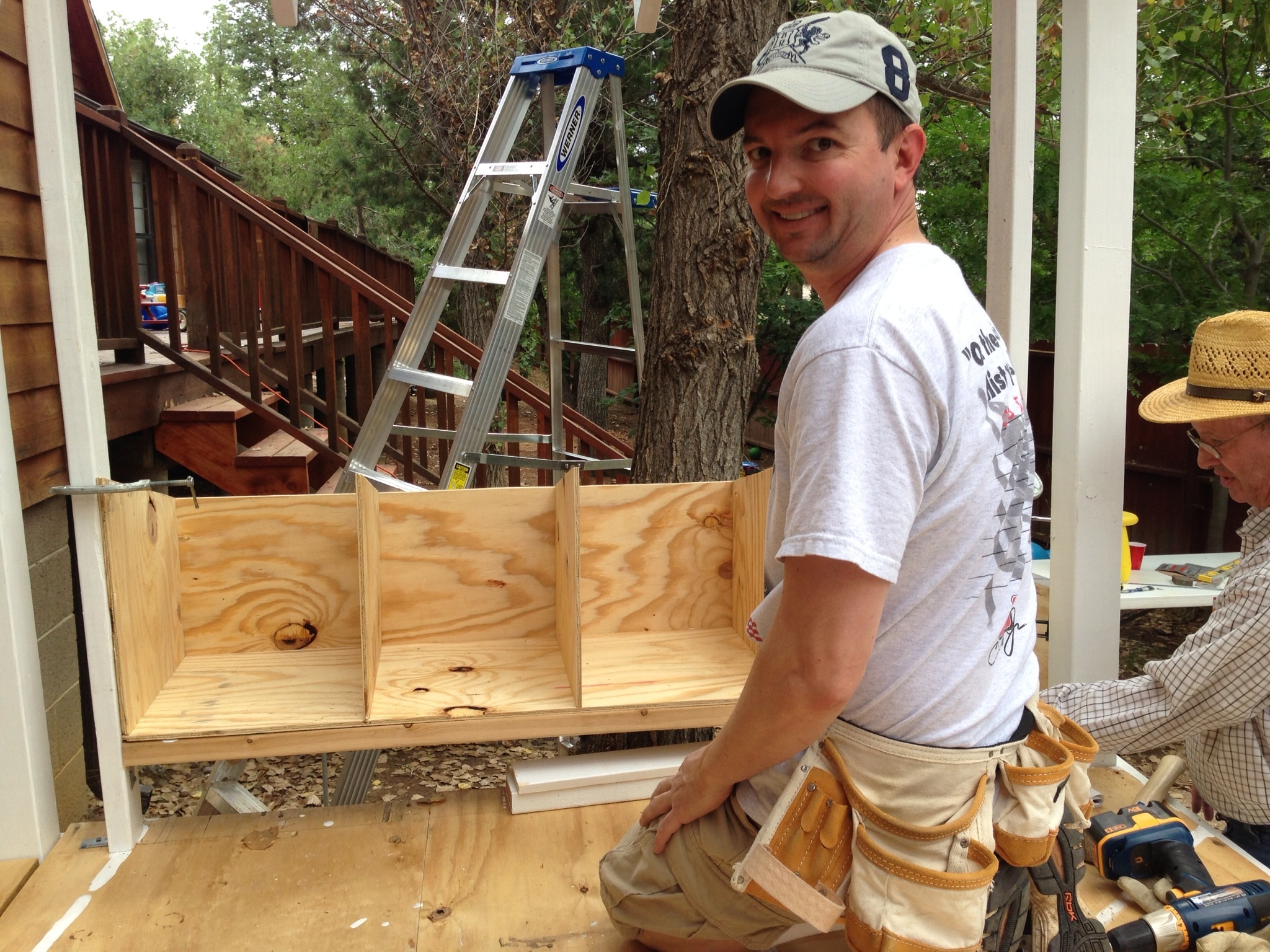 My husband working on the 4 nest boxes (14x14x16) with my father-in-law helping out.