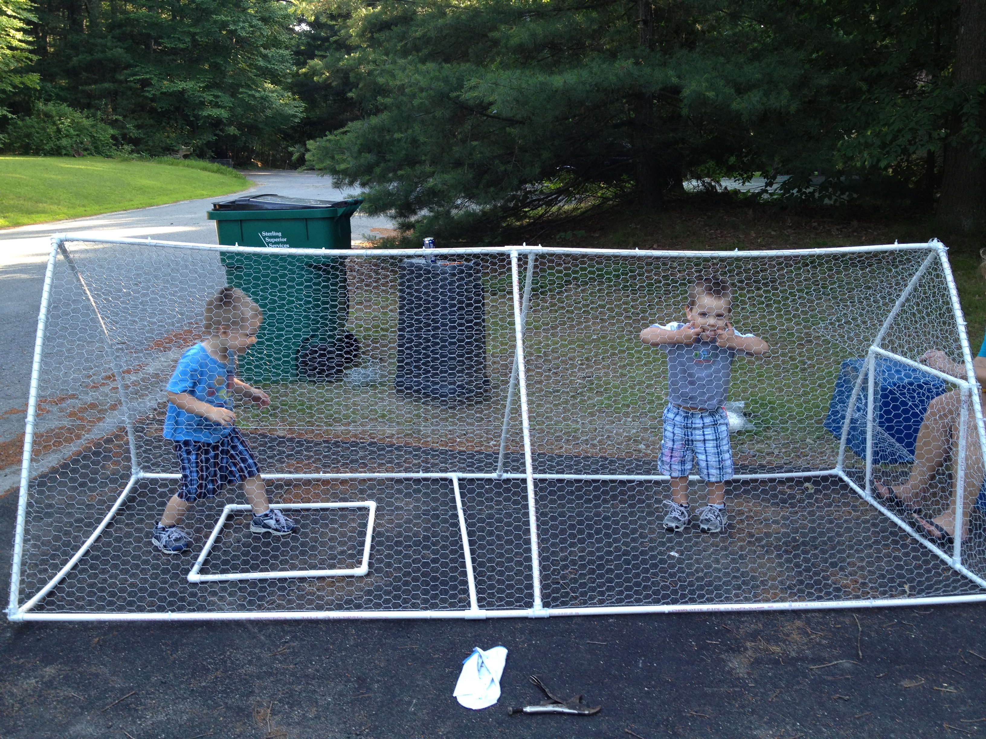 My twins goofing around inside while we were attaching the chicken wire! :)