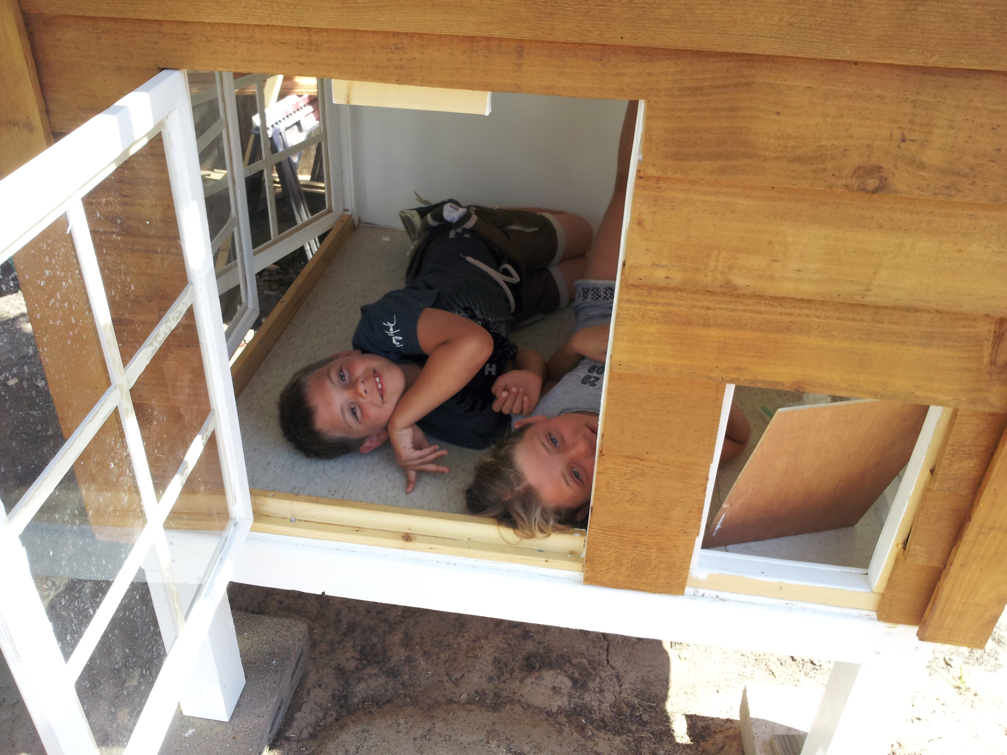 My two youngest enjoying the coop before the sand and the girls move in