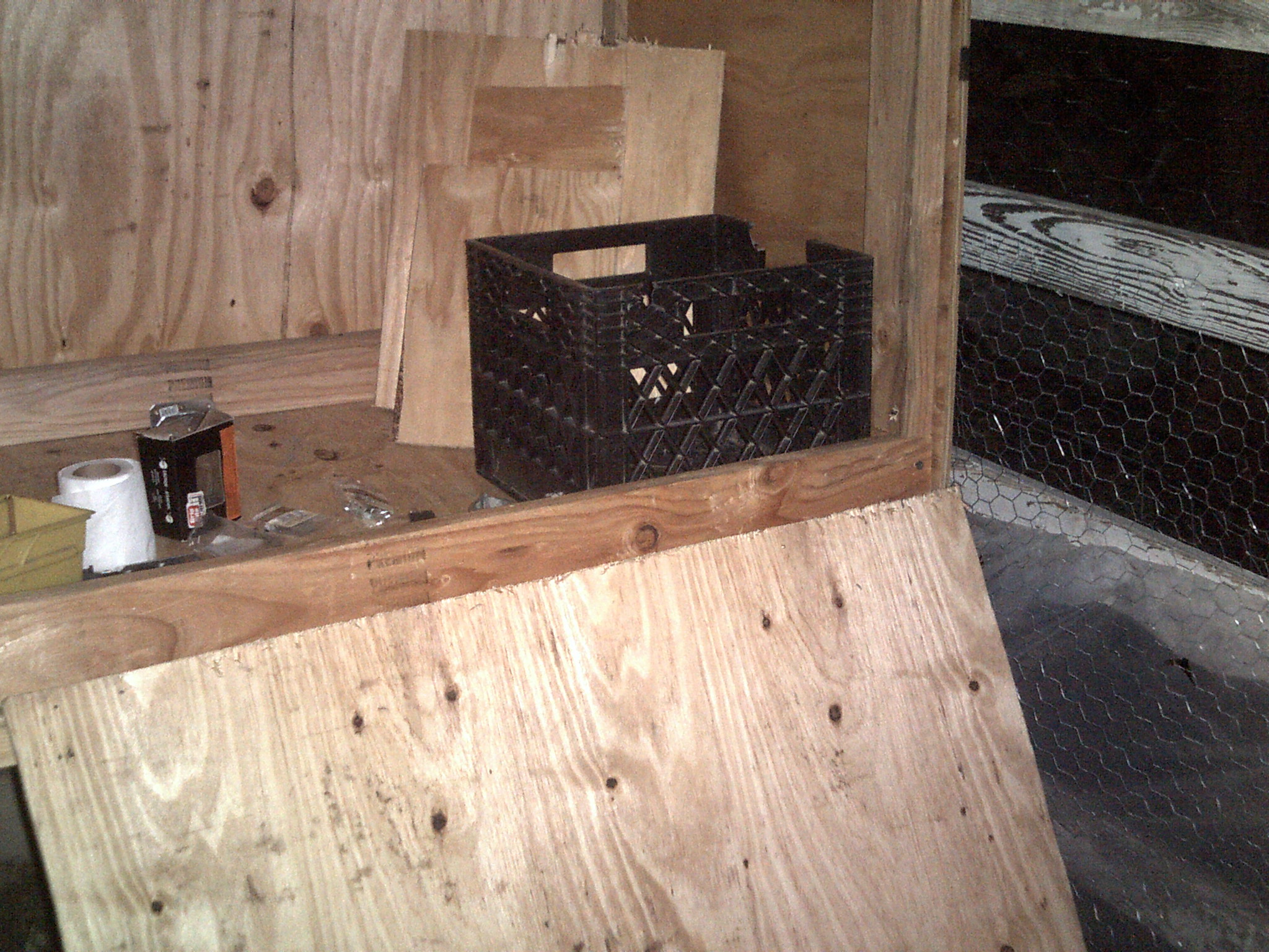 nest boxes under construction with one of the "nest boxes" in place