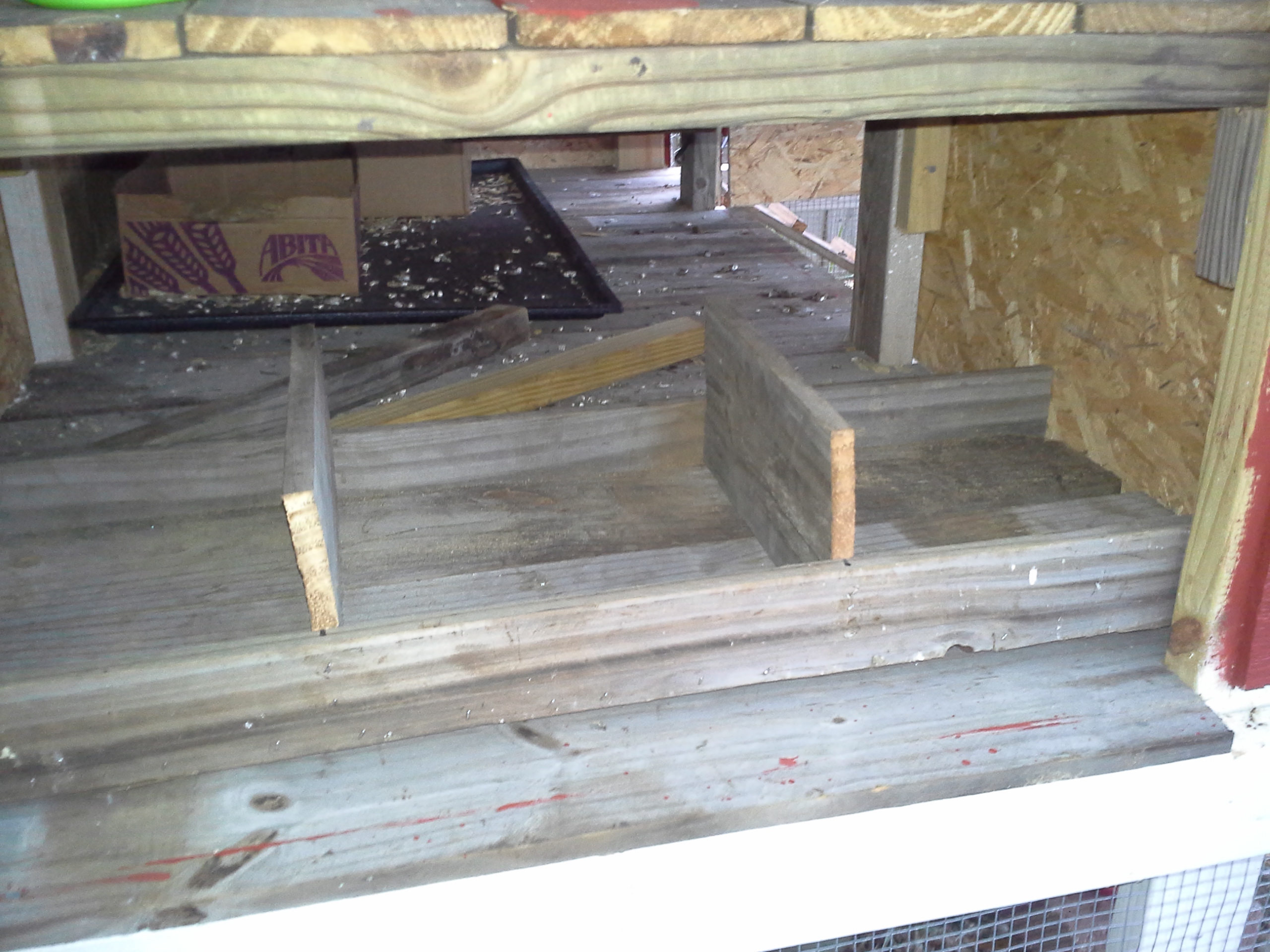 nesting boxes under storage shelf