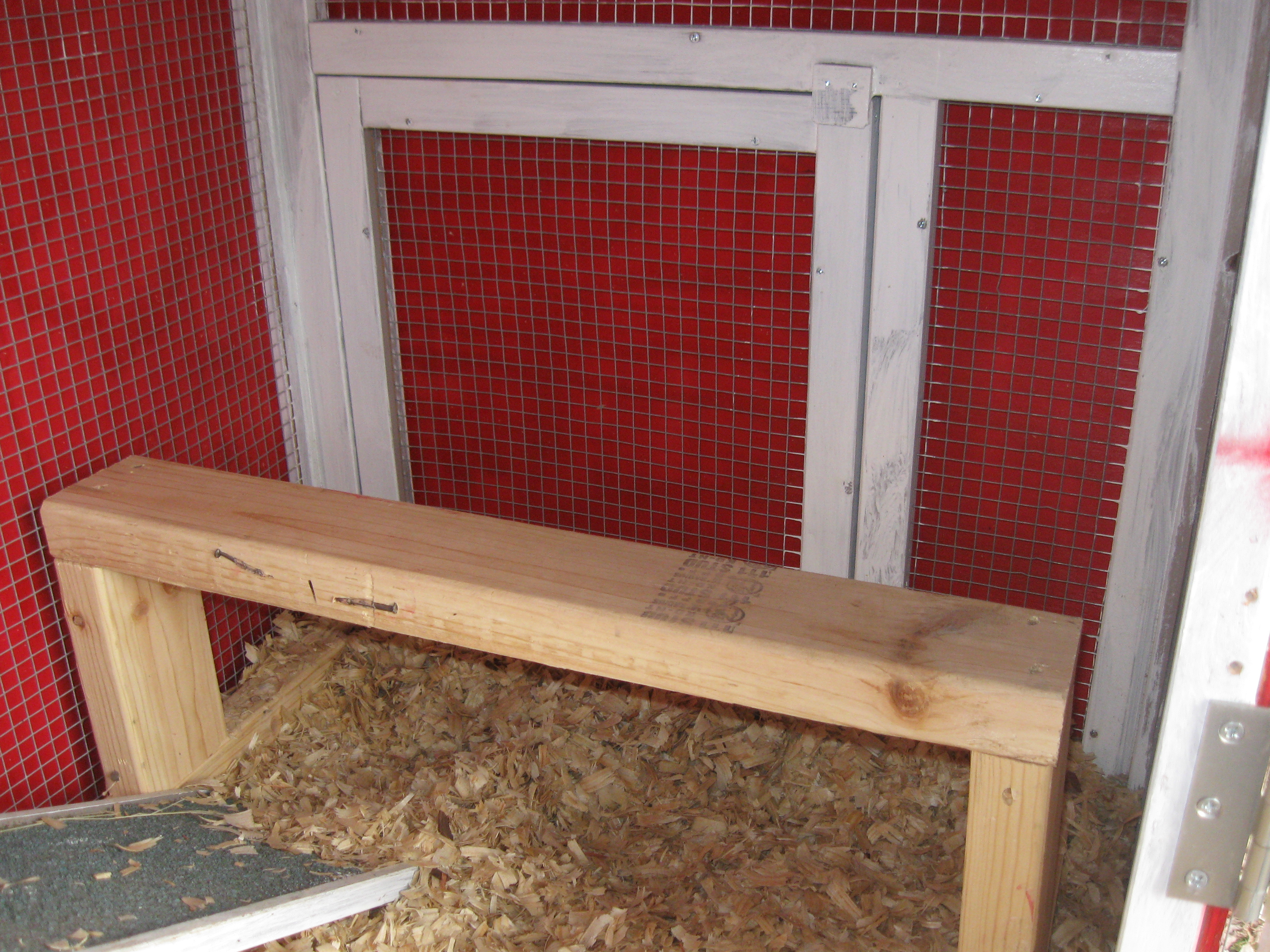 New downstairs roost. This was a coop from the tractor supply and the area that we had enclosed would have originally been the "run" if you just used it as was straight out of the box and assembled. We have always had the coop on a raised cedar platform in a large covered run. There was no way 4 hens would have enough room in that original coop.
