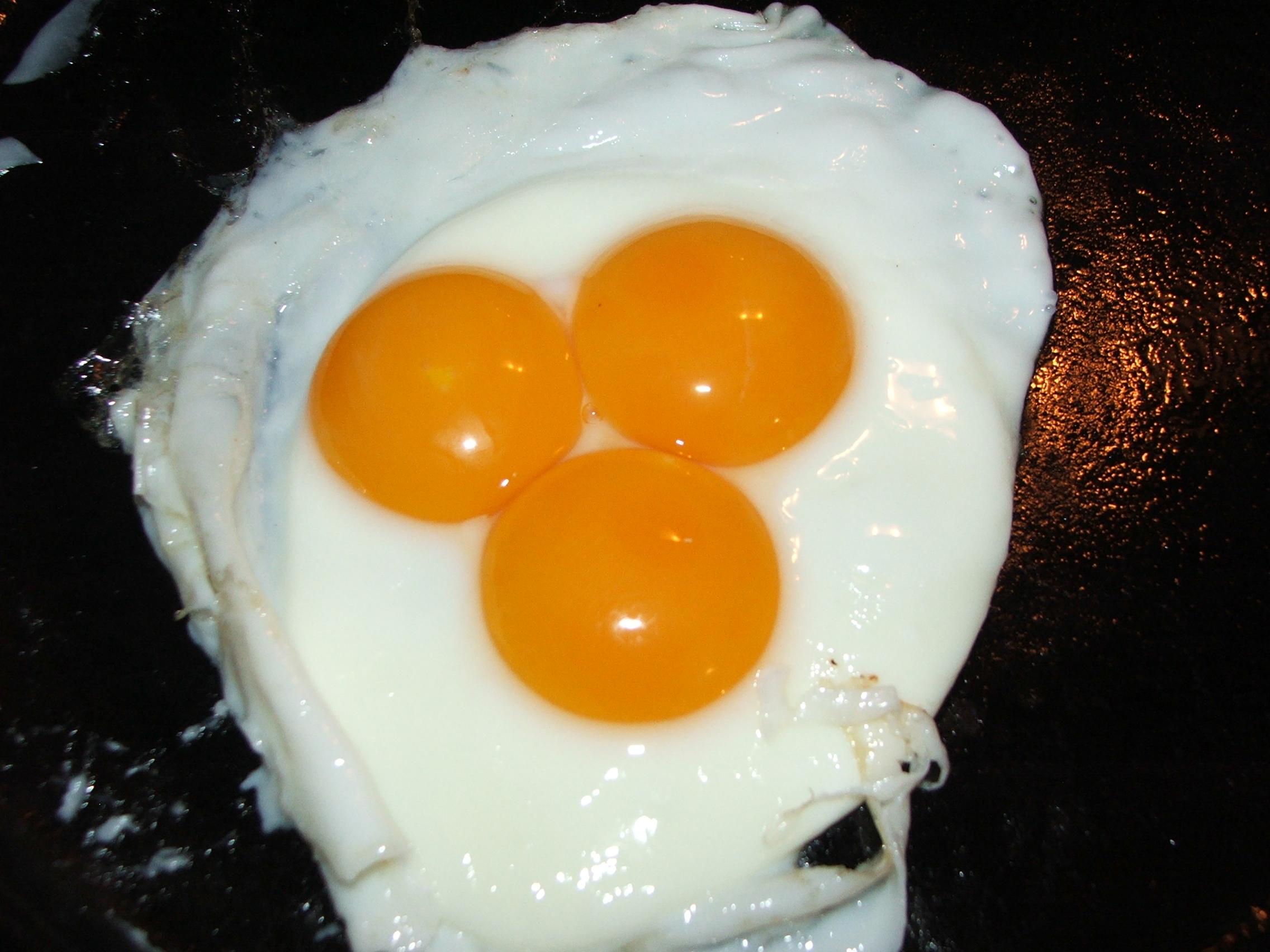 One of my chickens laid a very large egg yesterday.  I cracked it for breakfast expecting to find a double yoke but was surprised by this.  Anyone ever seen one of these?