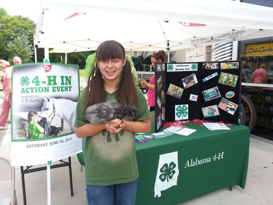 One of our 4-H fundraisers at TSC with a couple of chcikens